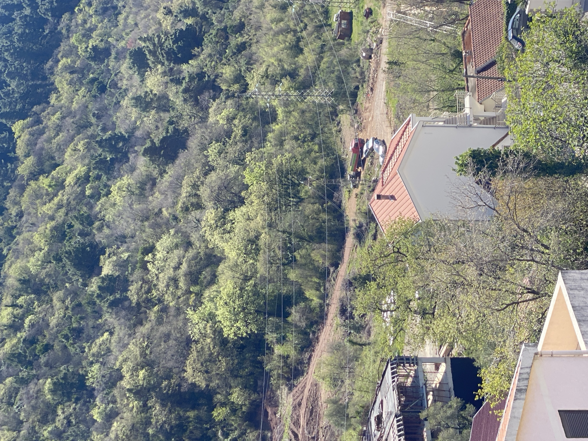 Budva Montenegro hillside construction activity observed April morning