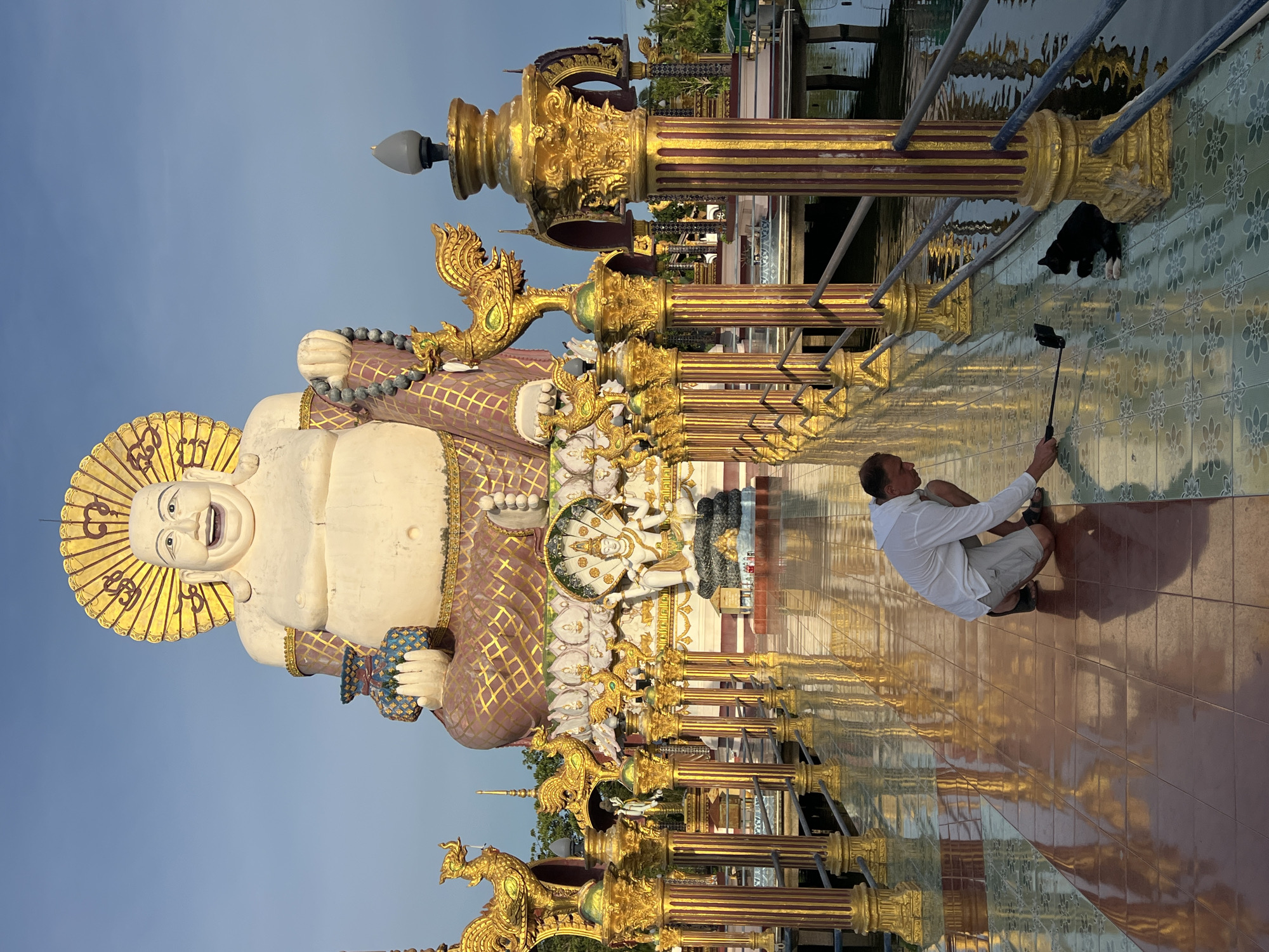 Morning at Wat Plai Laem's gilded temples, statues, and waterside wildlife