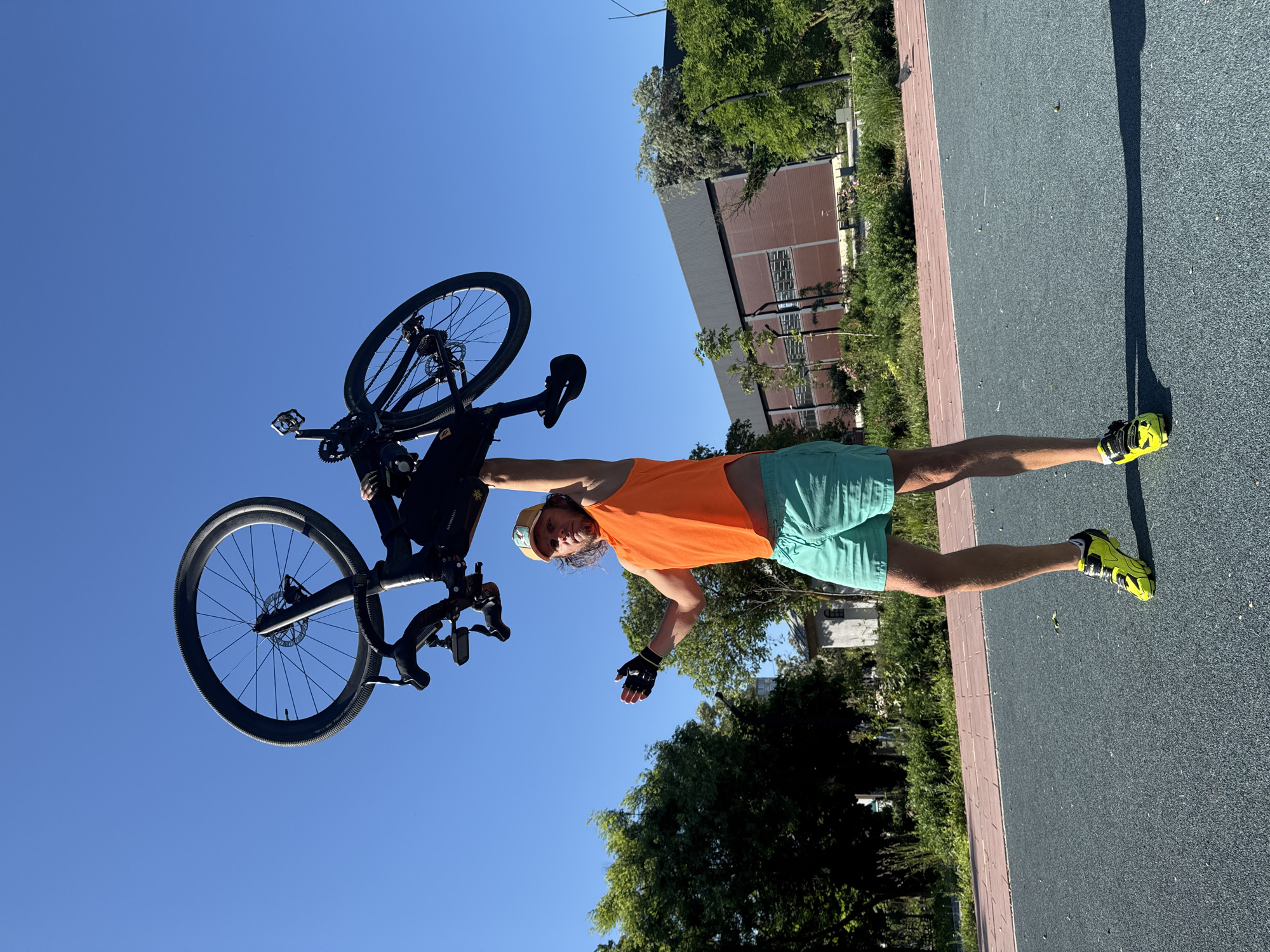 Man holds bicycle overhead in Ukrainian coastal town