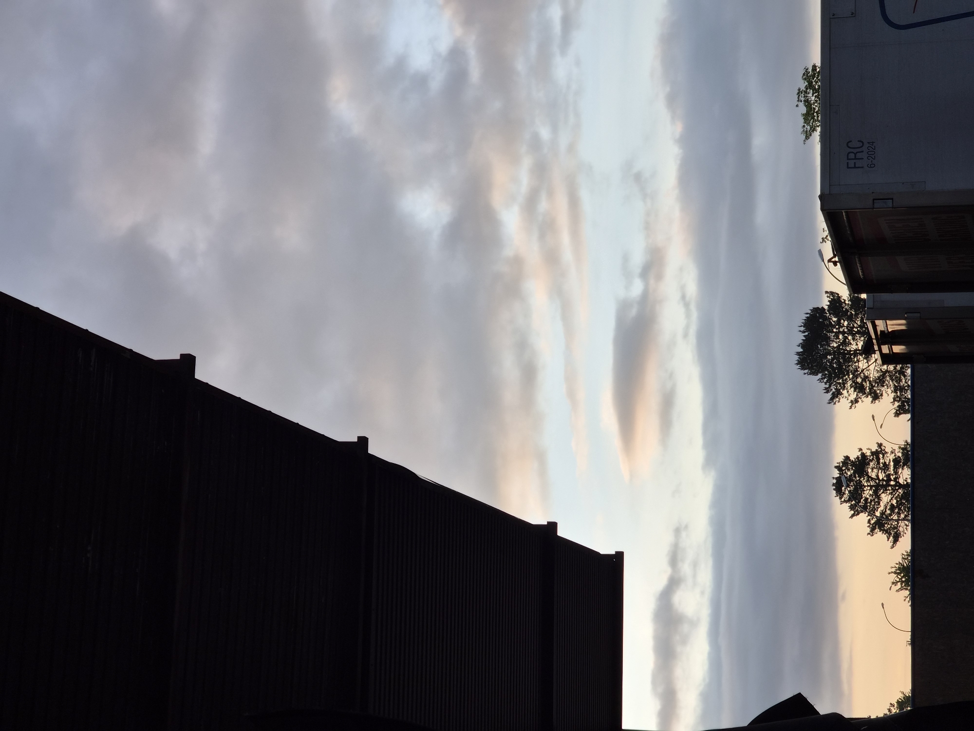 Dawn sky and commercial district observed in Leudelange