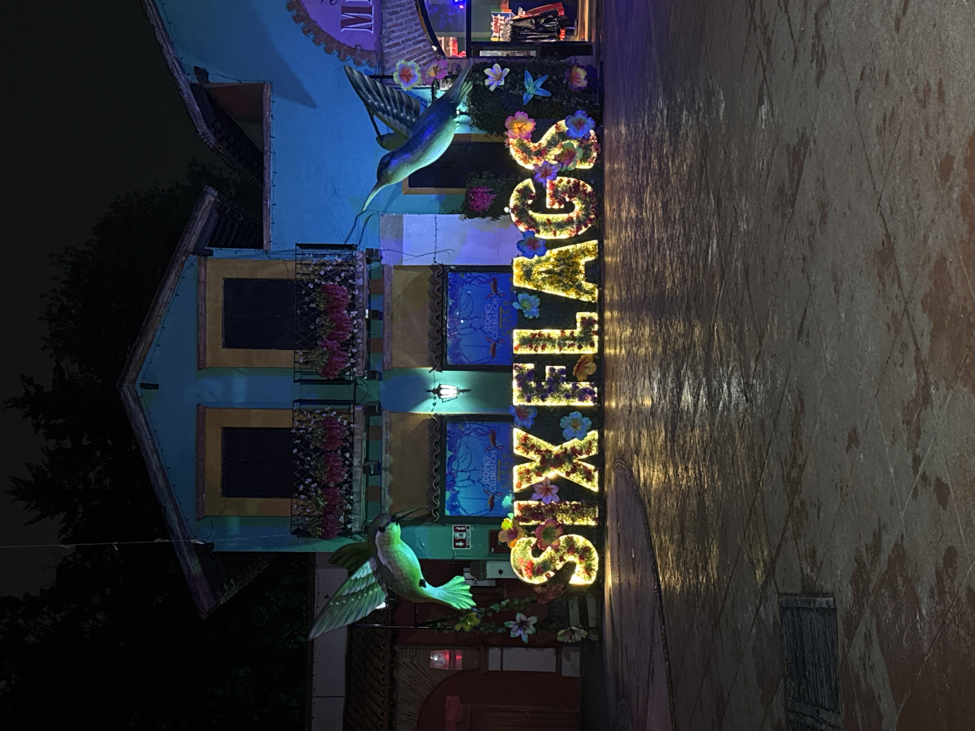 Neon Superman logo glows in Mexico City night