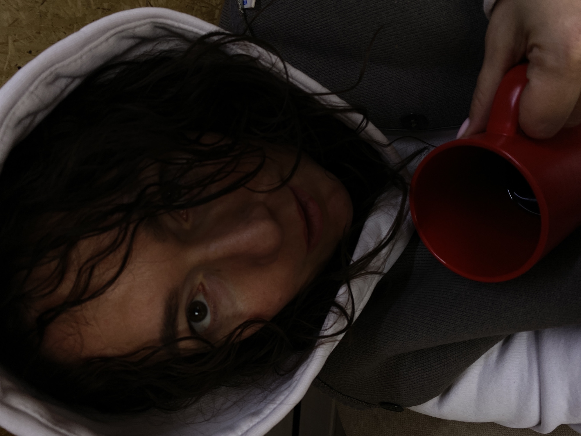Person with red mug photographed in Ol'khovskoye, Russia