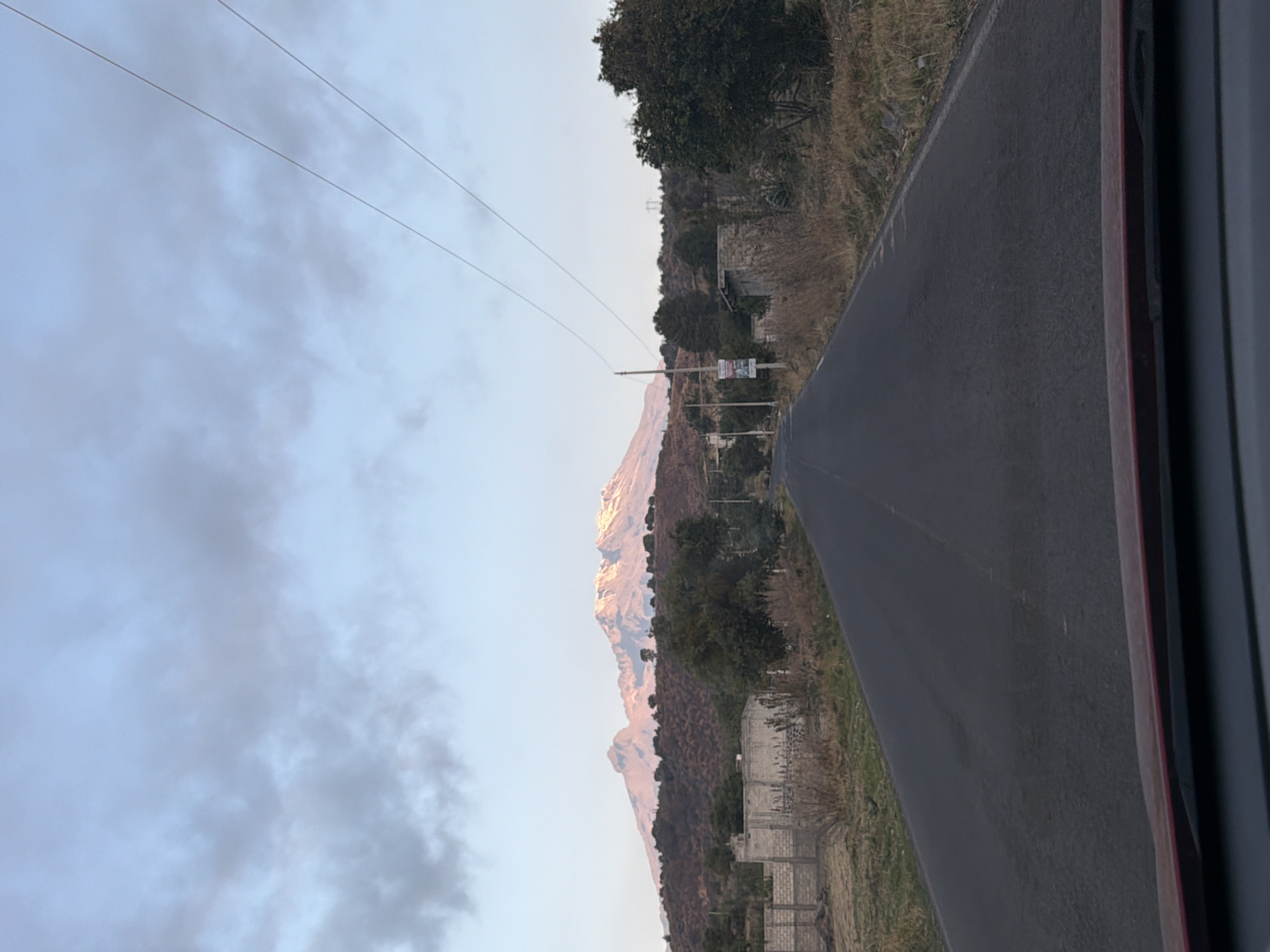 Mountain landscape captured from moving vehicle near Santiago Xalitzintla
