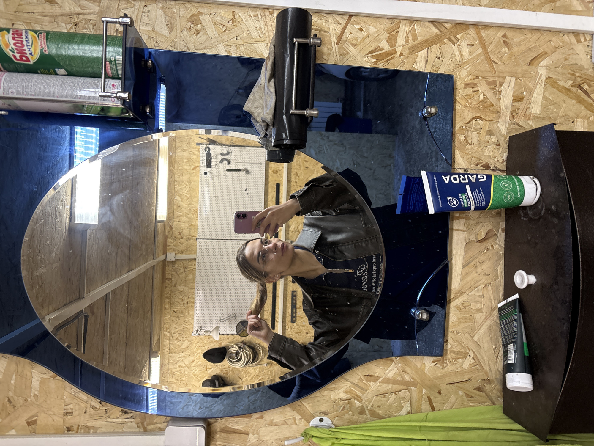Person Takes Selfie in Blue-Framed Mirror in Ust-Ilimsk