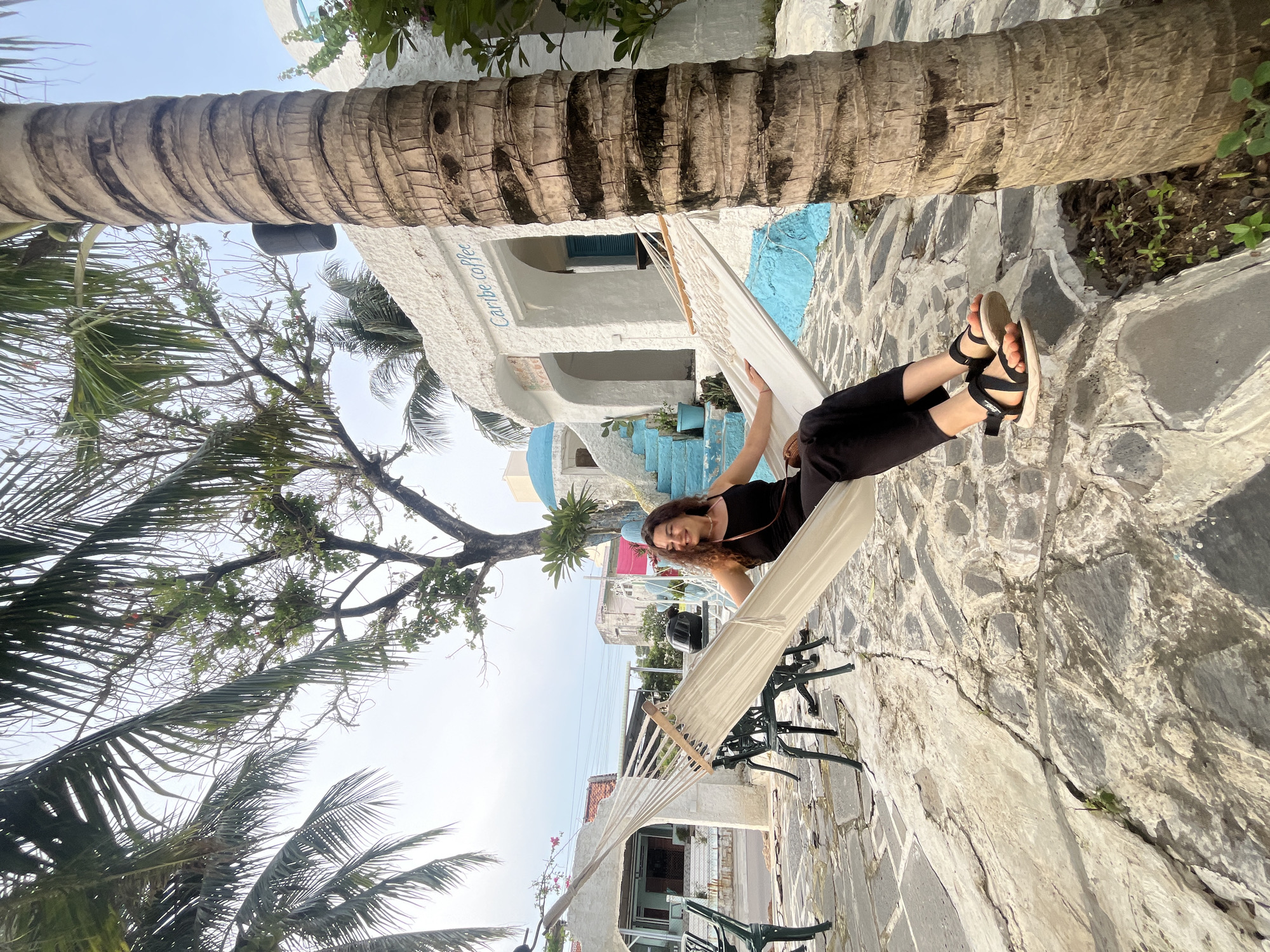 Posing around a blue-and-white café in coastal Vietnam