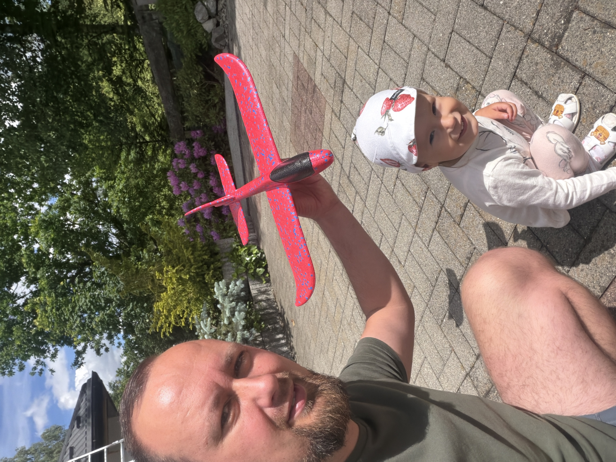 Father and child enjoy outdoor playtime in Wisła, Poland