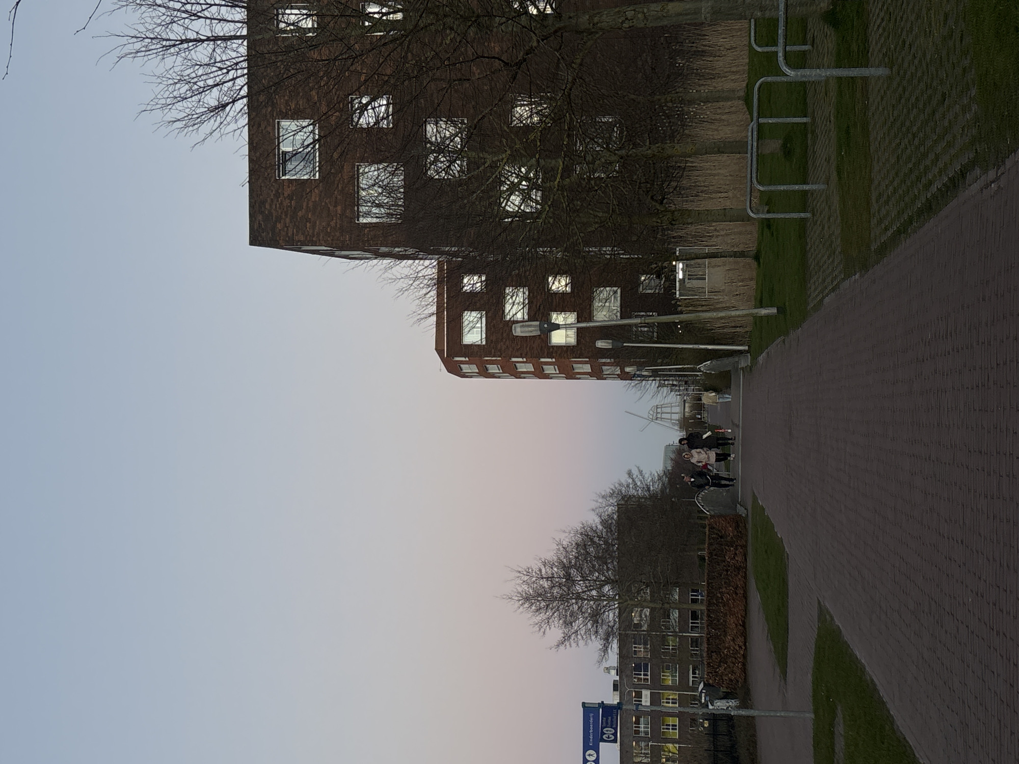 Street scene captured in Leeuwarden showing modern brick buildings