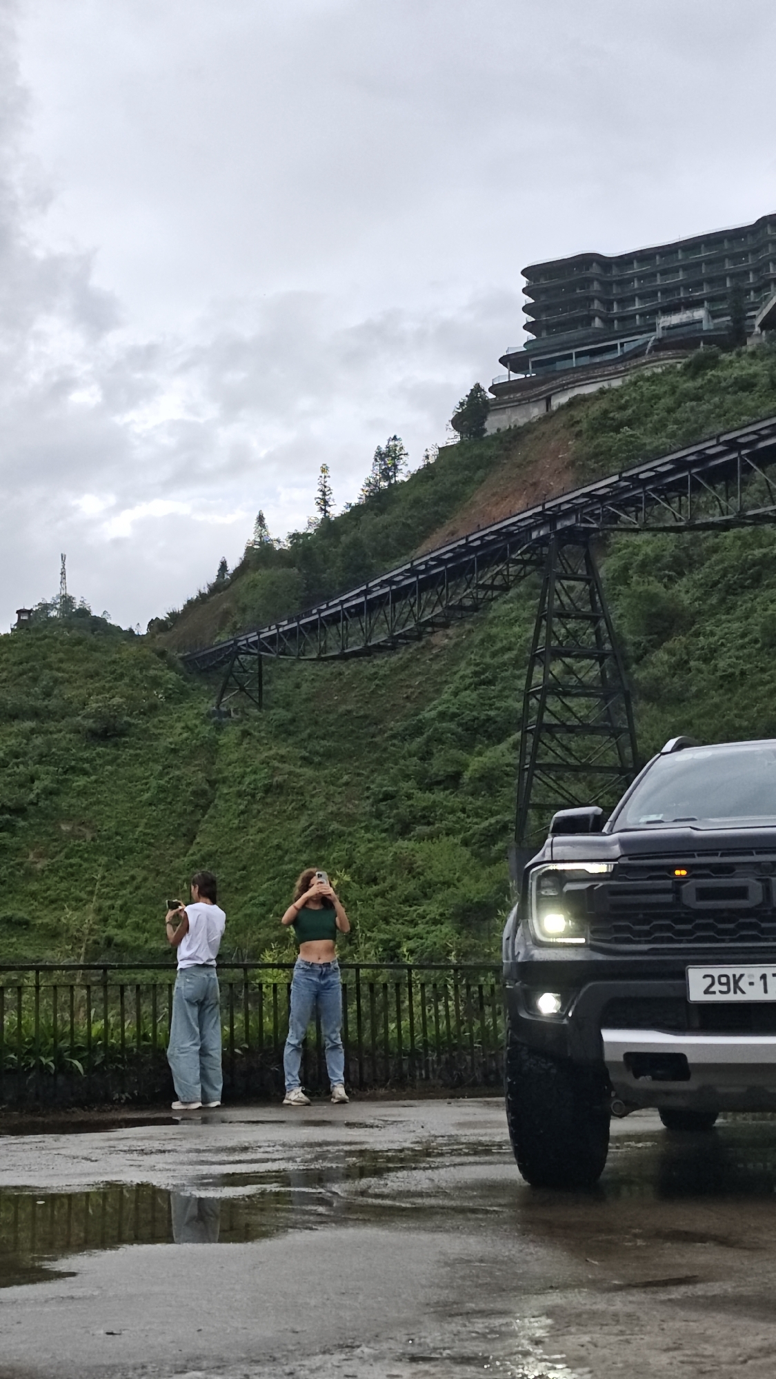 Tourists capture scenic mountain views at Vietnamese highland village