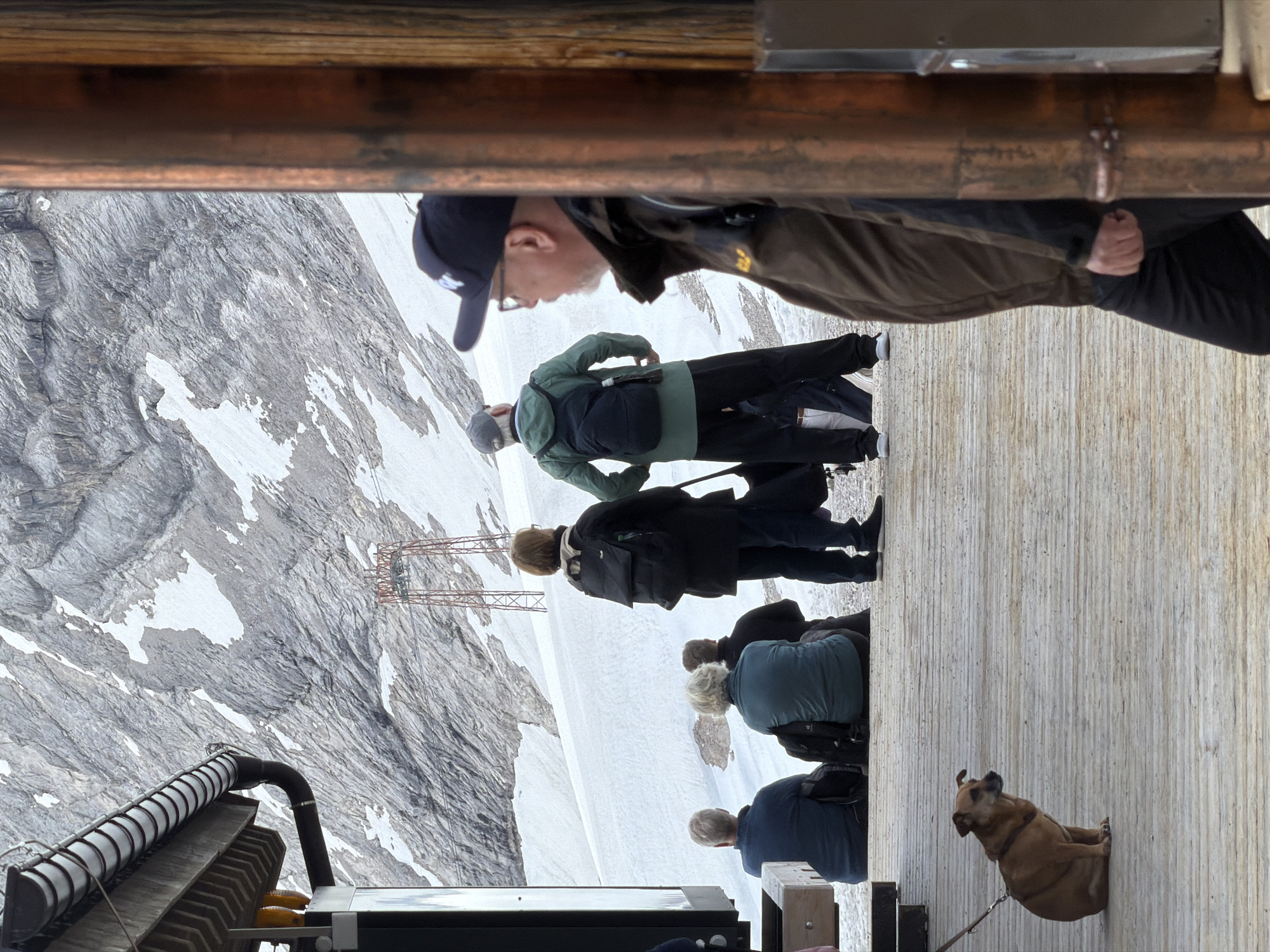 Visitors gather at Zugspitze summit restaurant amid Alpine views