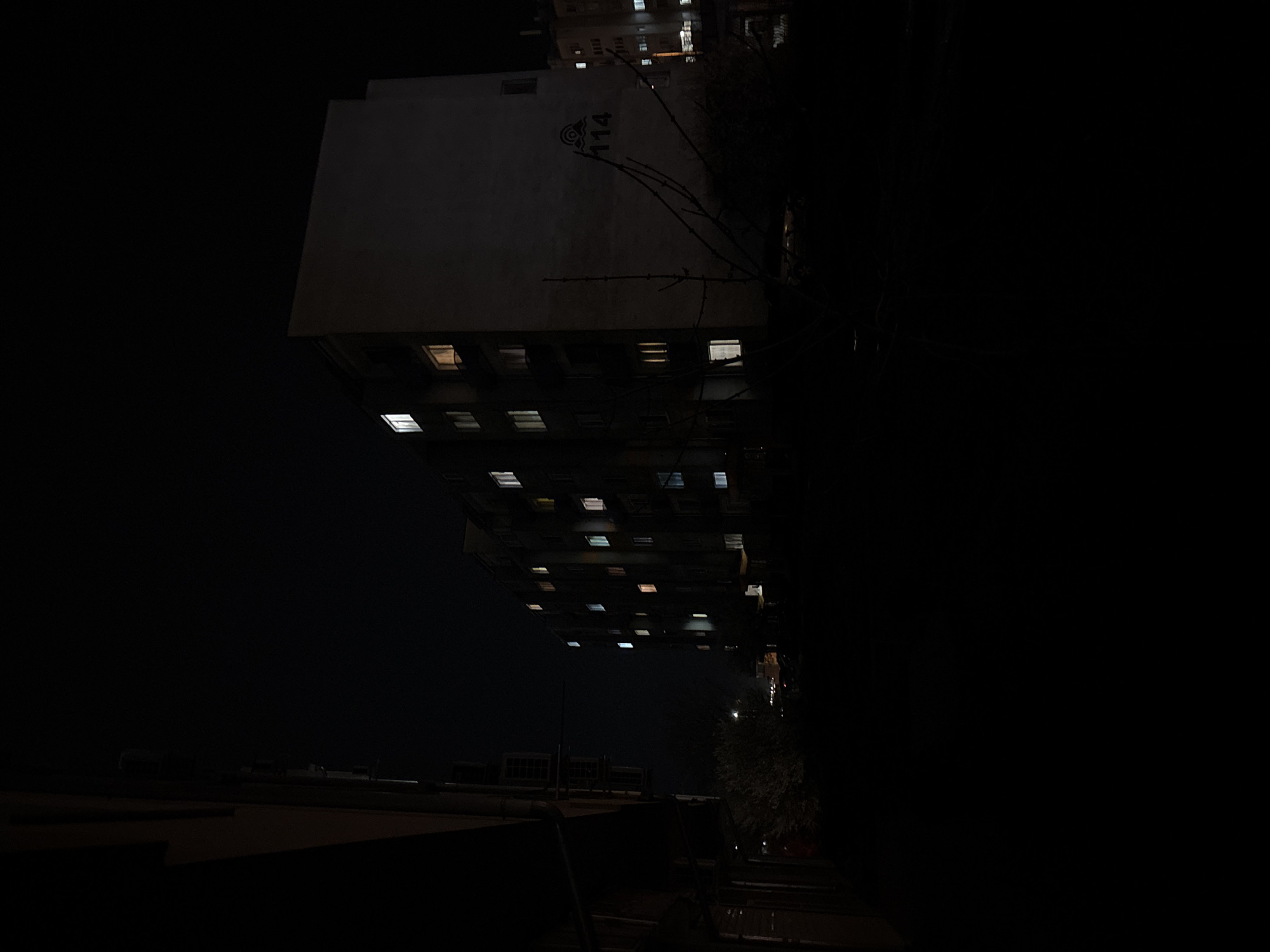 Evening streetlights illuminate occupied buildings in Burgas, Bulgaria