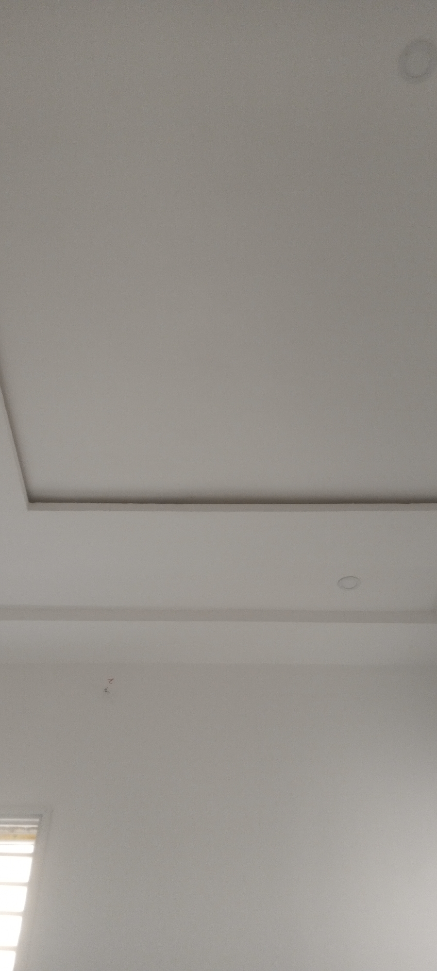 Interior room features documented: white walls, barred windows, recessed lighting
