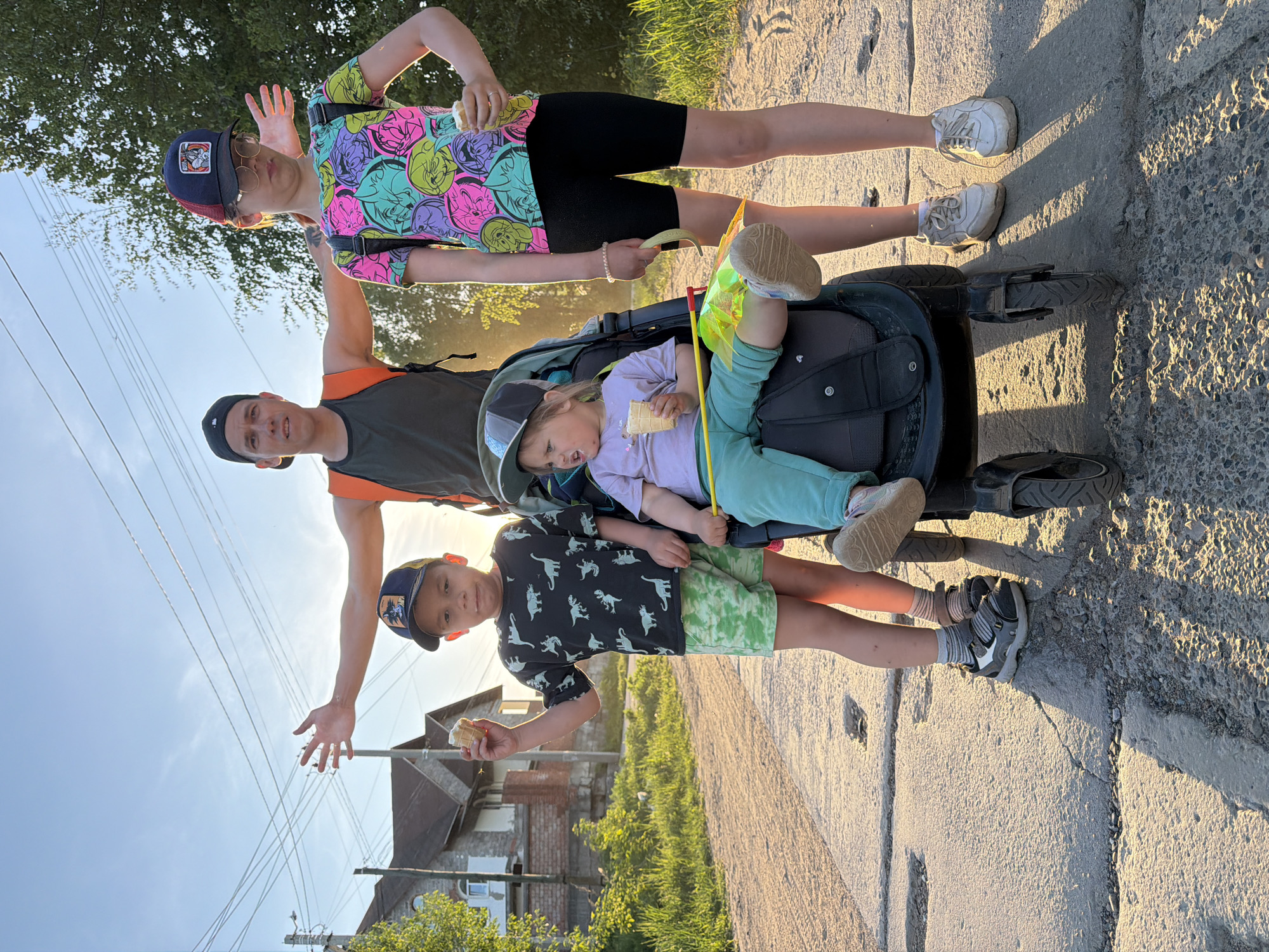 Family travels through Chaikovsky, Russia with stroller and children