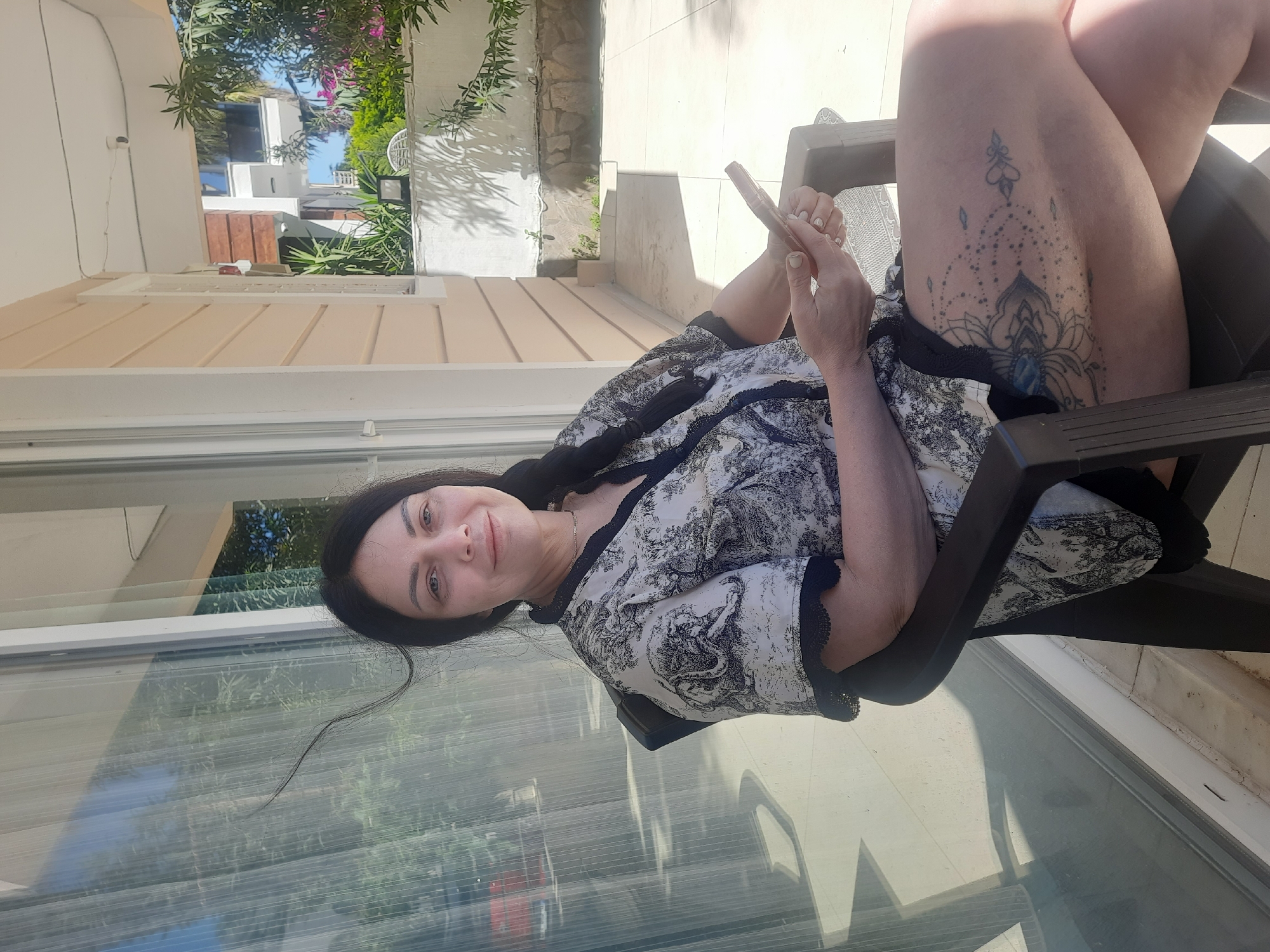 Woman photographed on sunny patio in Kemer, Turkey
