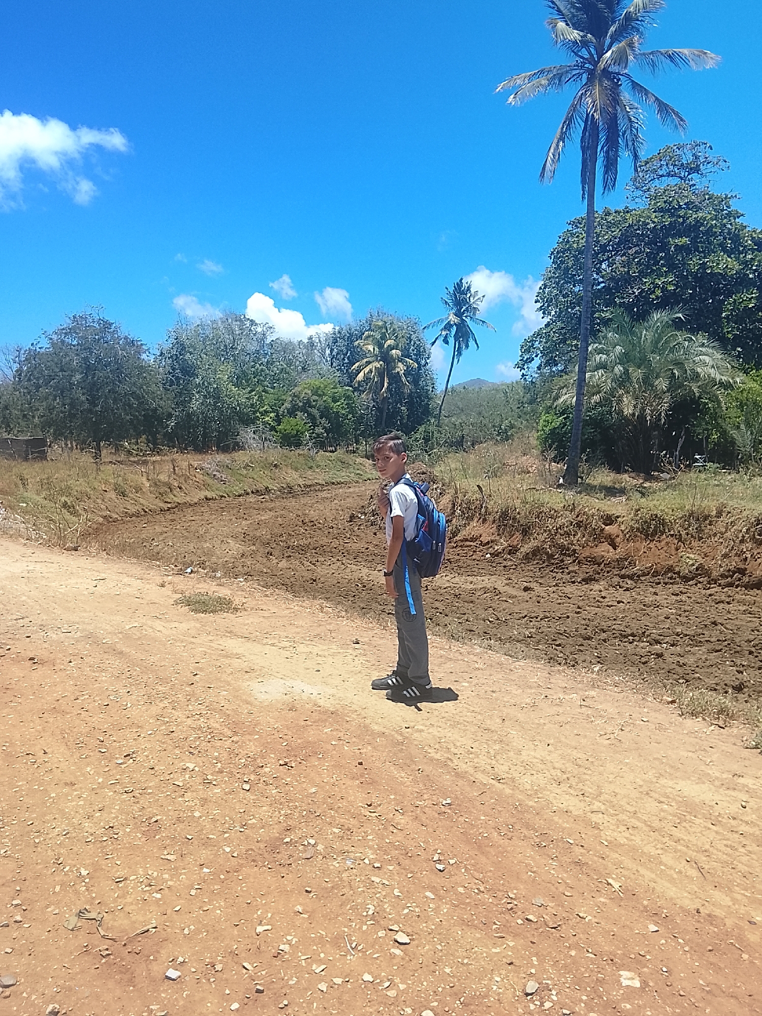 Boy photographed on dirt road in Altagracia, Venezuela