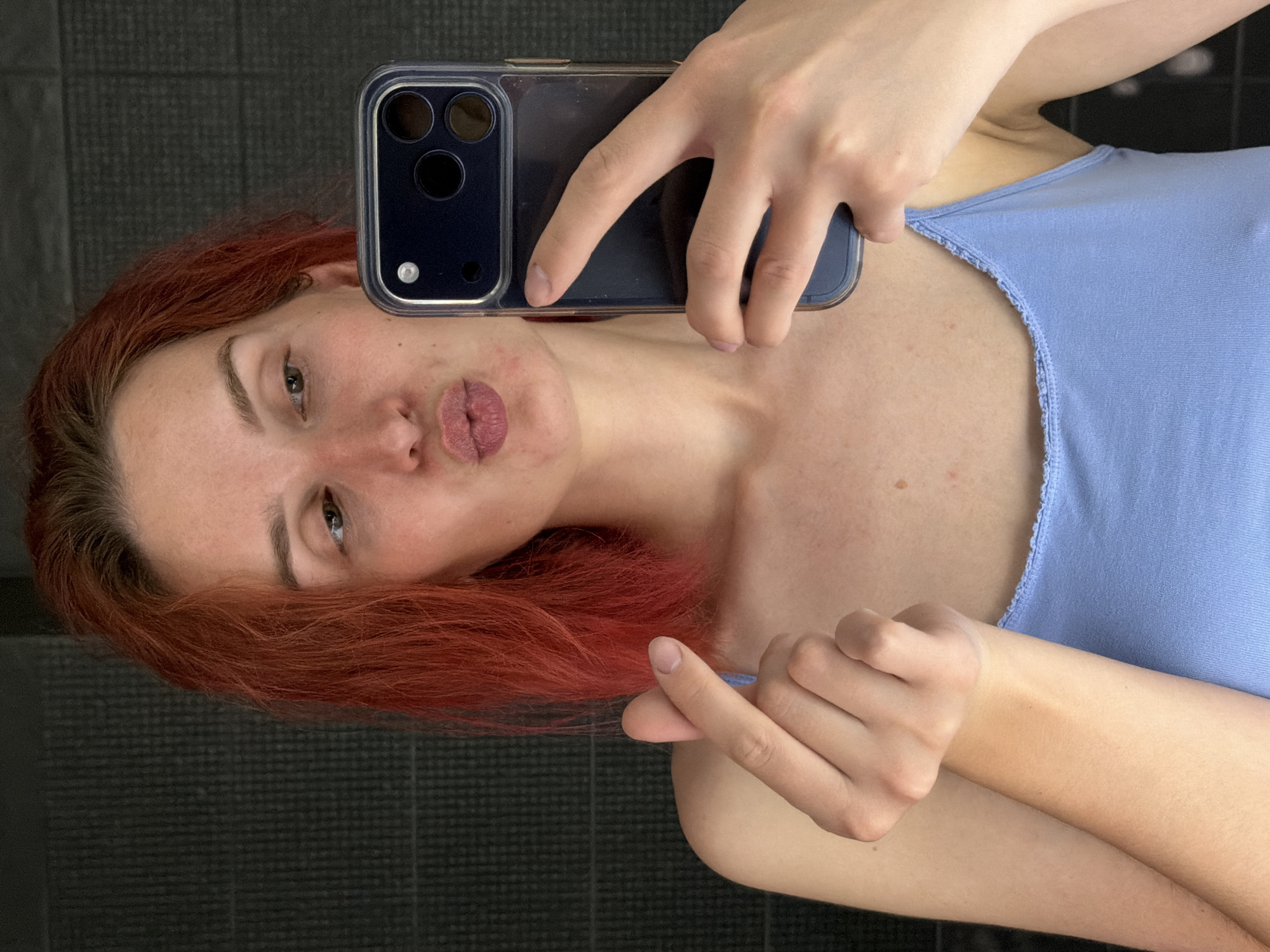 Woman takes bathroom selfies while cat plays in Chaikovsky
