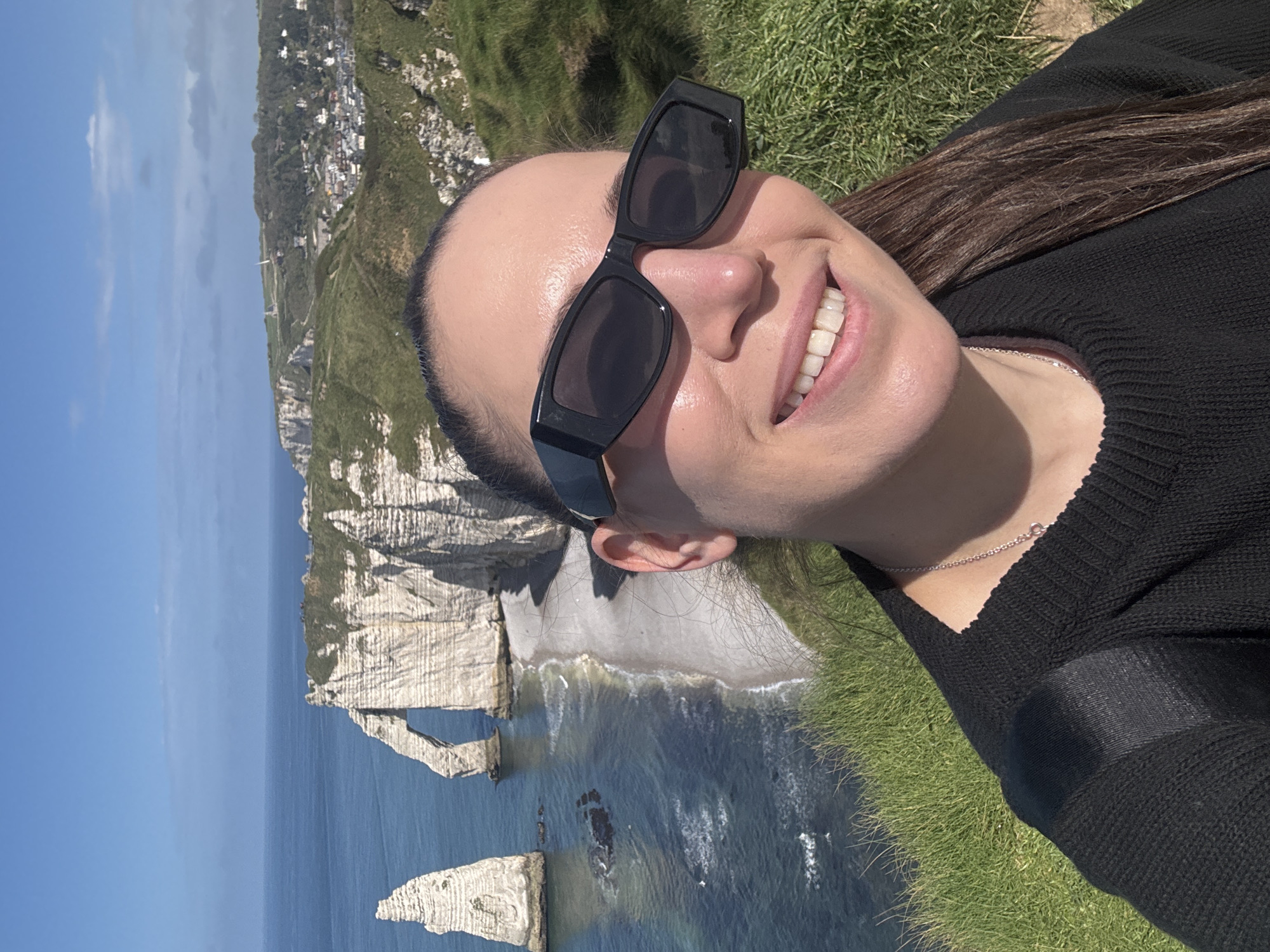 Tourists enjoy sunny day at Étretat's dramatic chalk cliffs