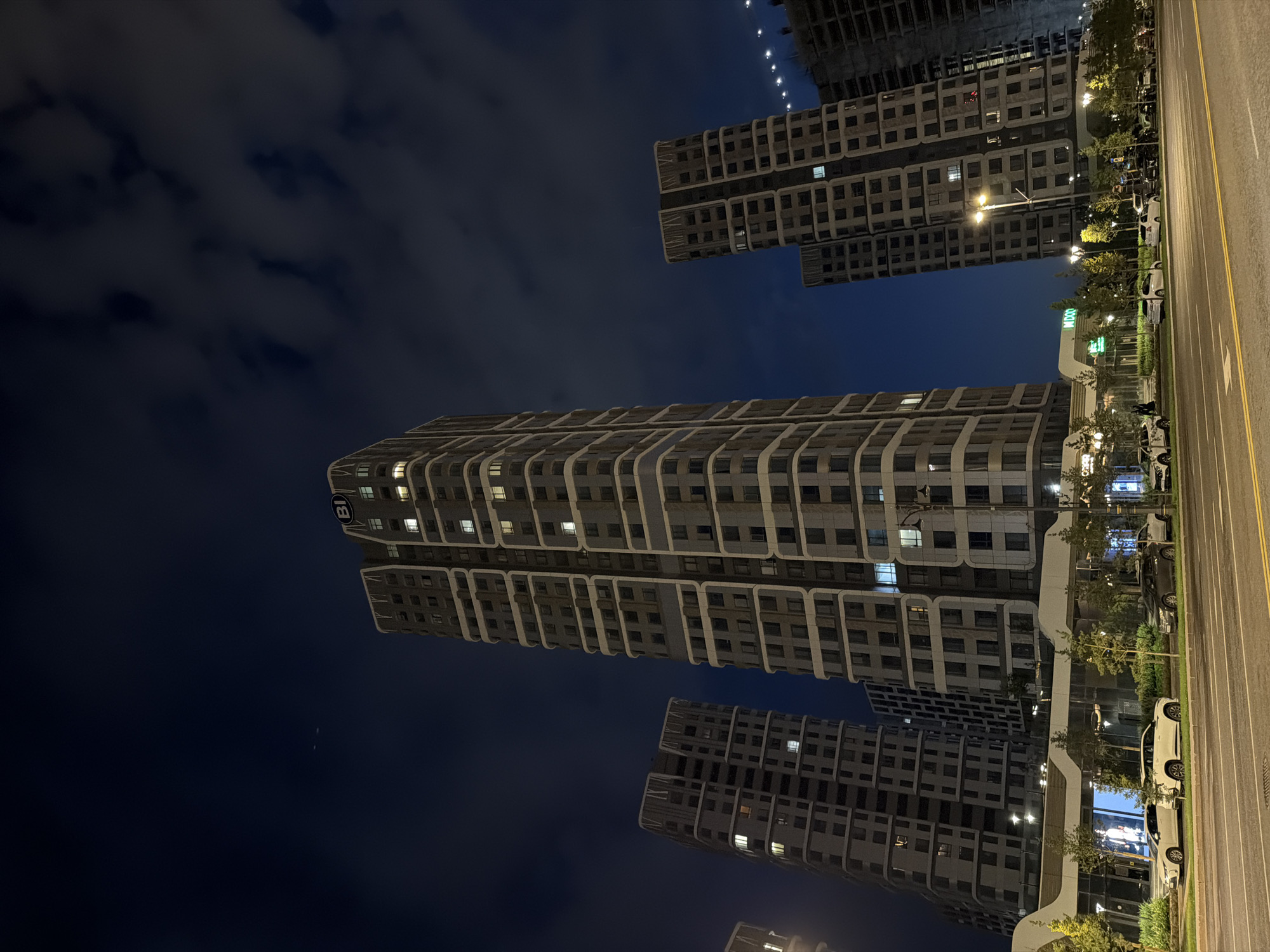 Astana's modern skyline at night, streets active