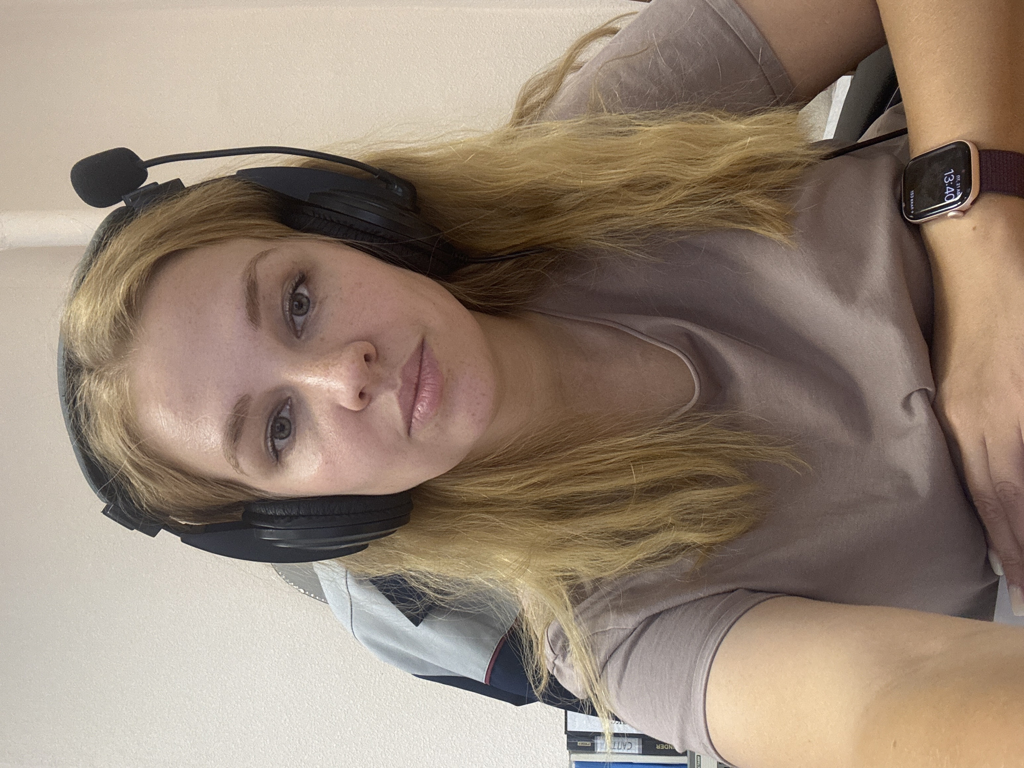 Headphone-wearing desk setup, possible streaming or recording session