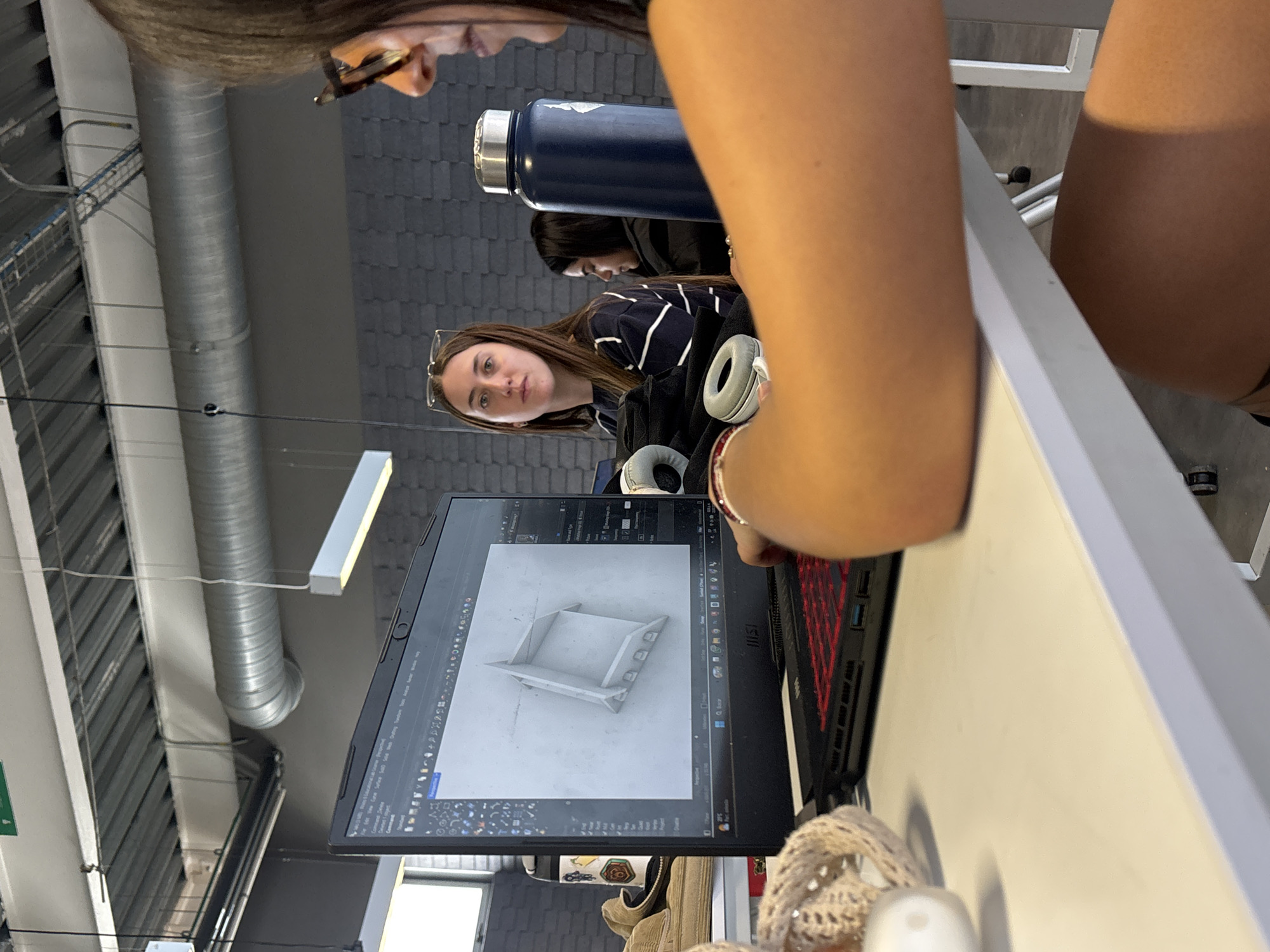 Students collaborate on laptop projects in Mexico City study area