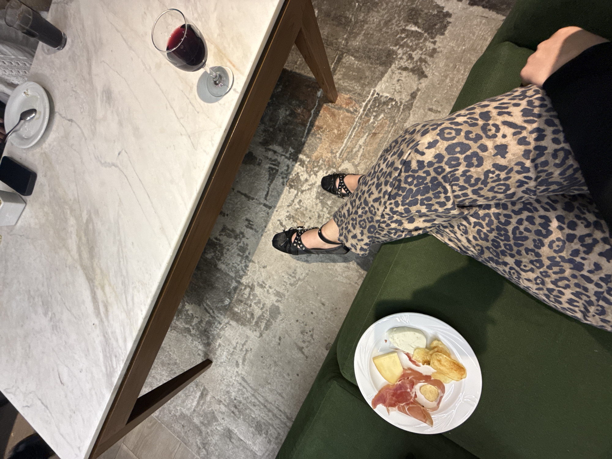 Woman enjoys wine and charcuterie evening at home in Mexico City