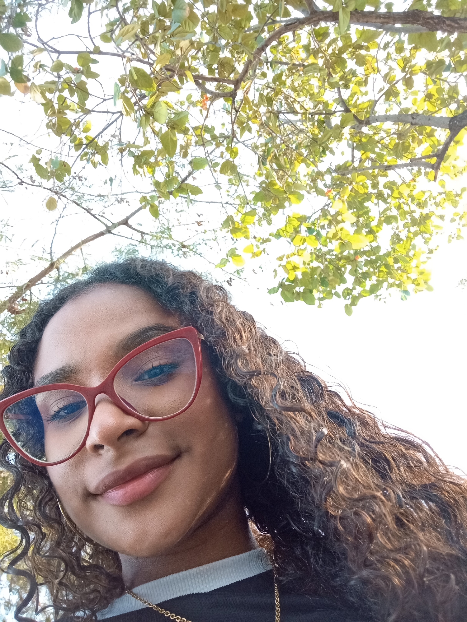 Woman photographed under tree canopy in Juan Griego