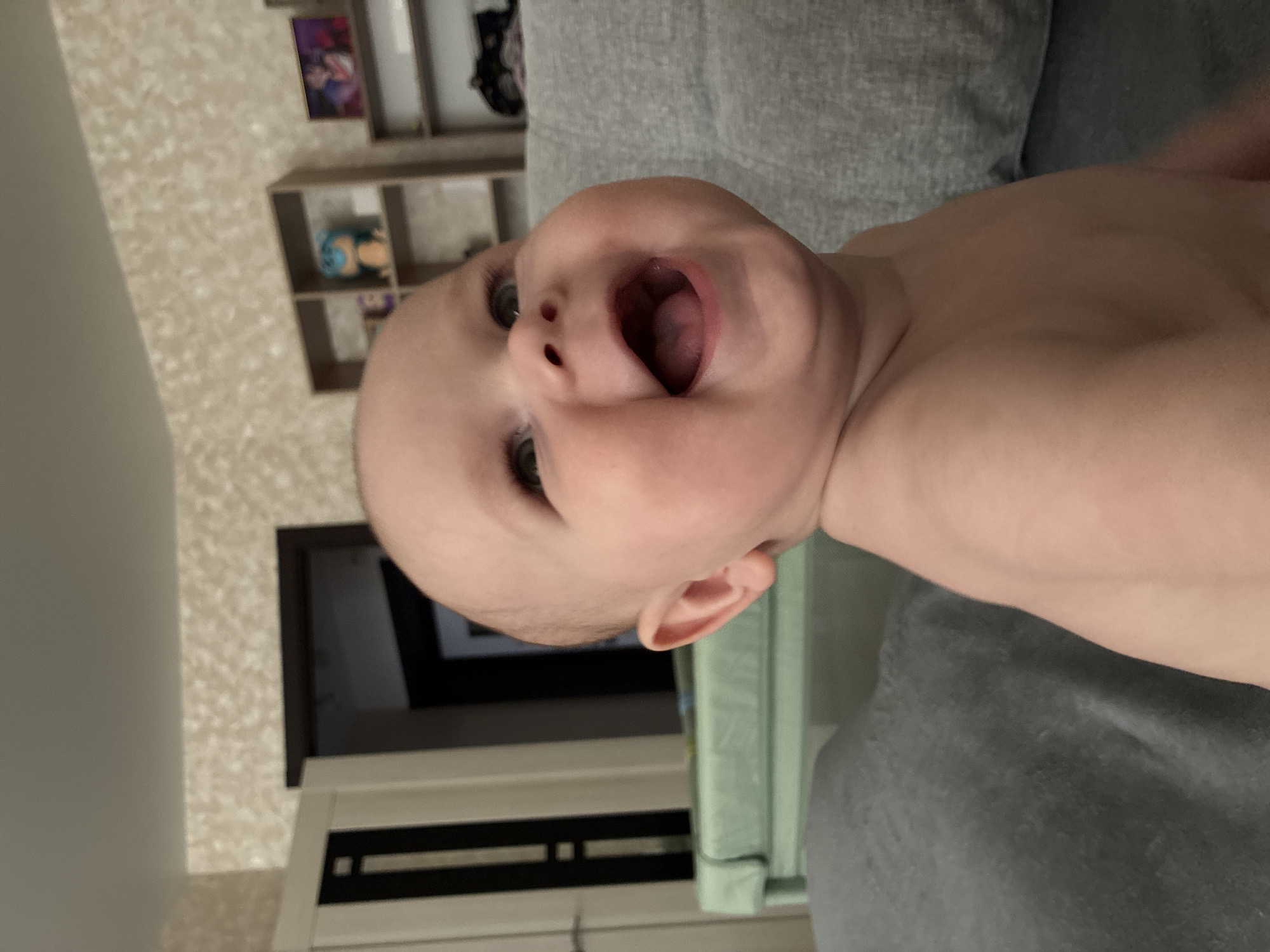 Baby moments and tablet gaming, with a Tver cityscape overhead