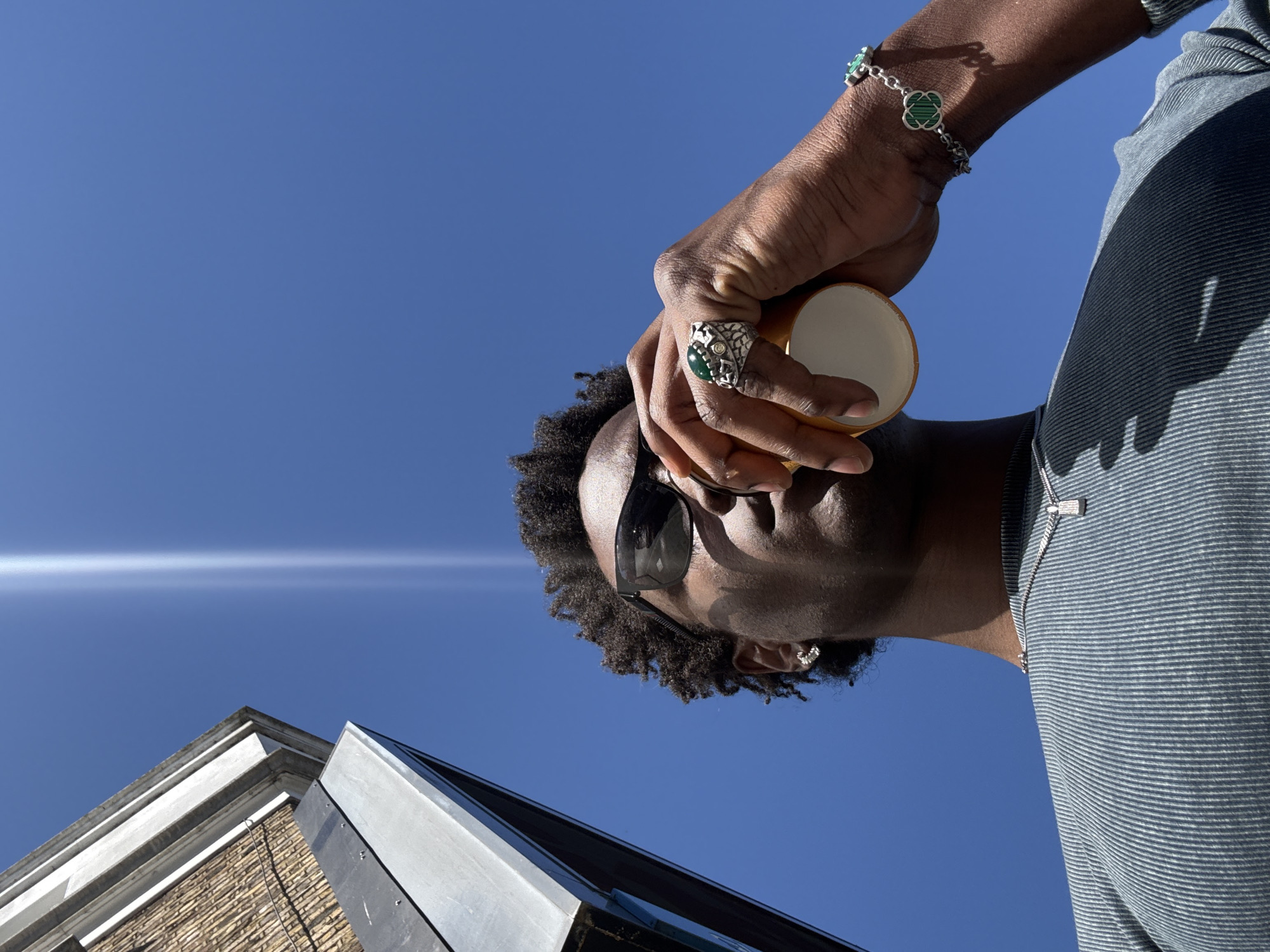 Man with yellow cup spotted outdoors in London