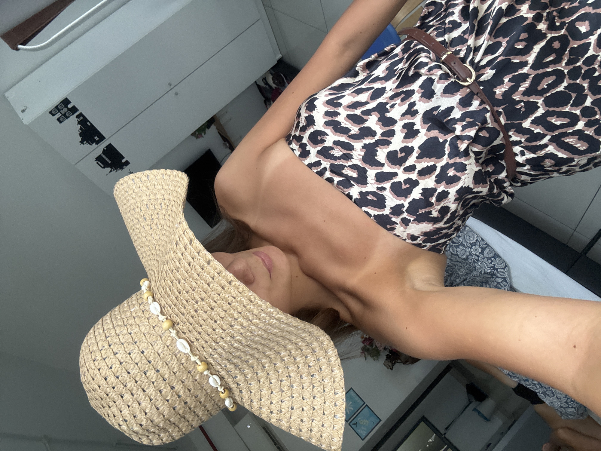 Woman documents breakfast product photos in leopard dress, Kuala Lumpur