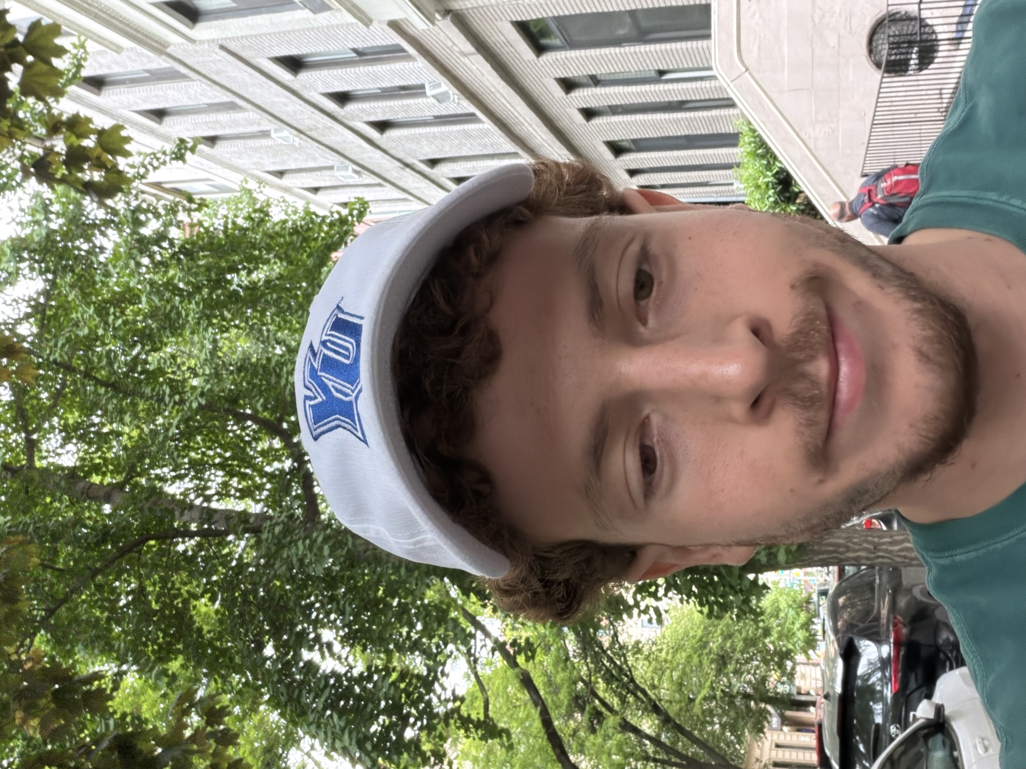 Man in baseball cap observed at NYC outdoor venue
