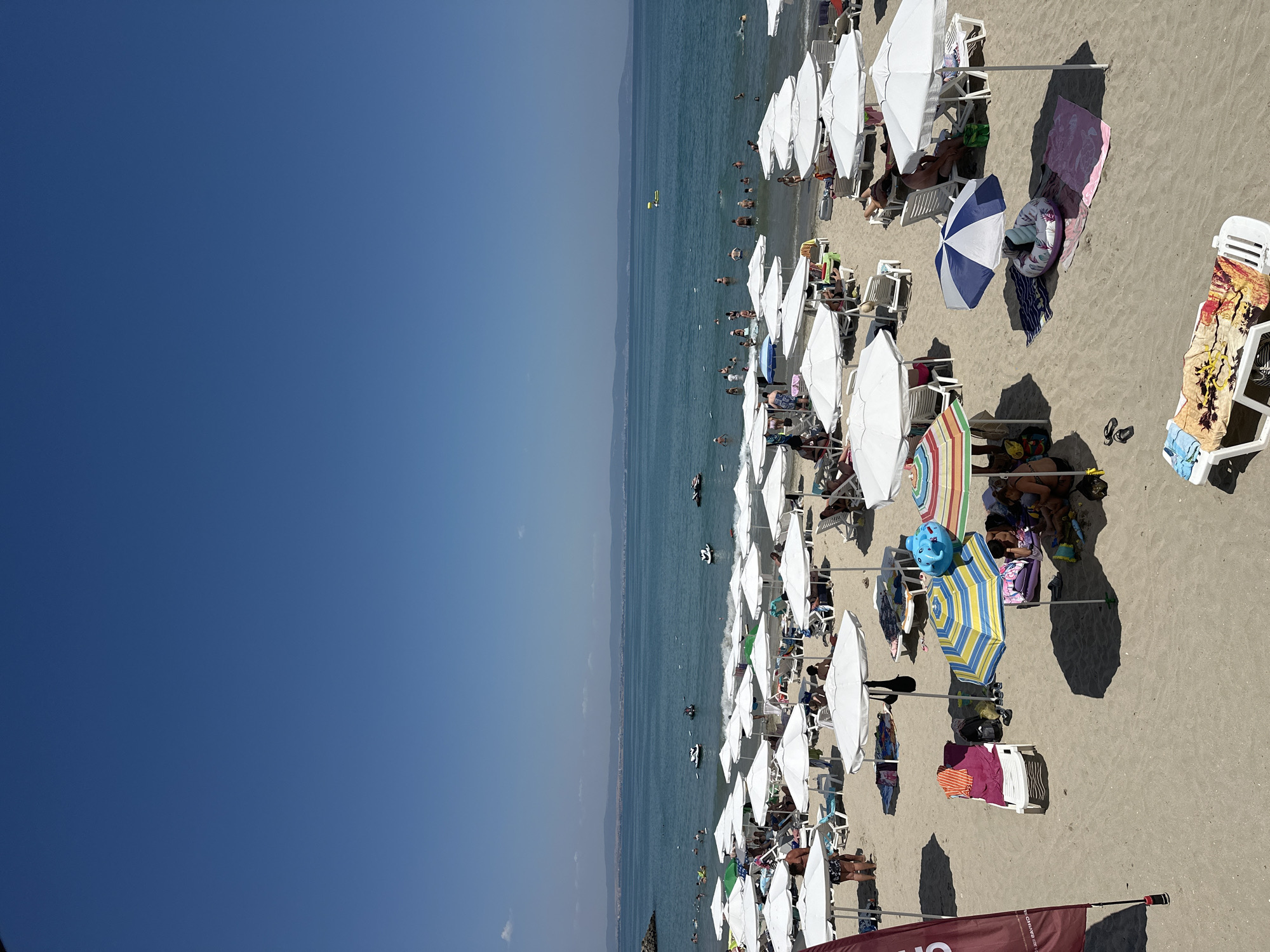 Packed summer beach day in Pomorie, Bulgaria