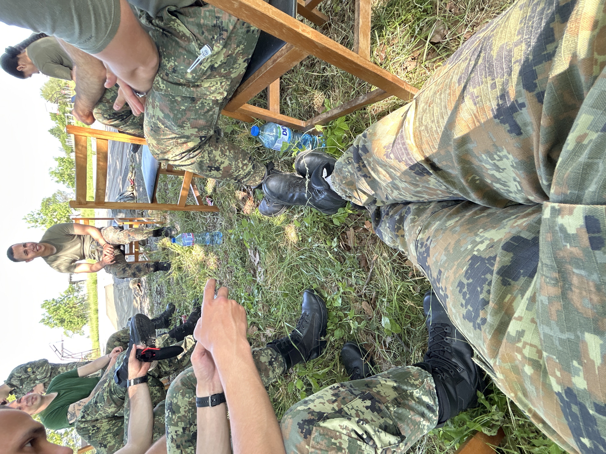 Military-dressed group gathers at outdoor facility in Bulgaria