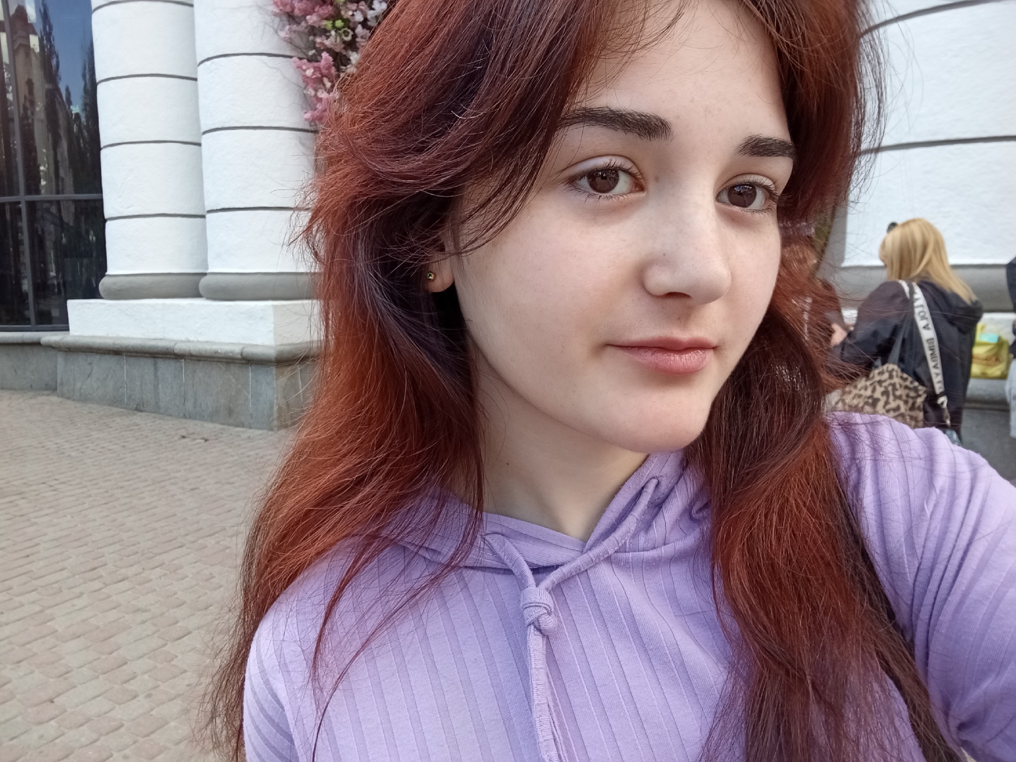 Woman documents mall visit with selfies in Poltava, Ukraine