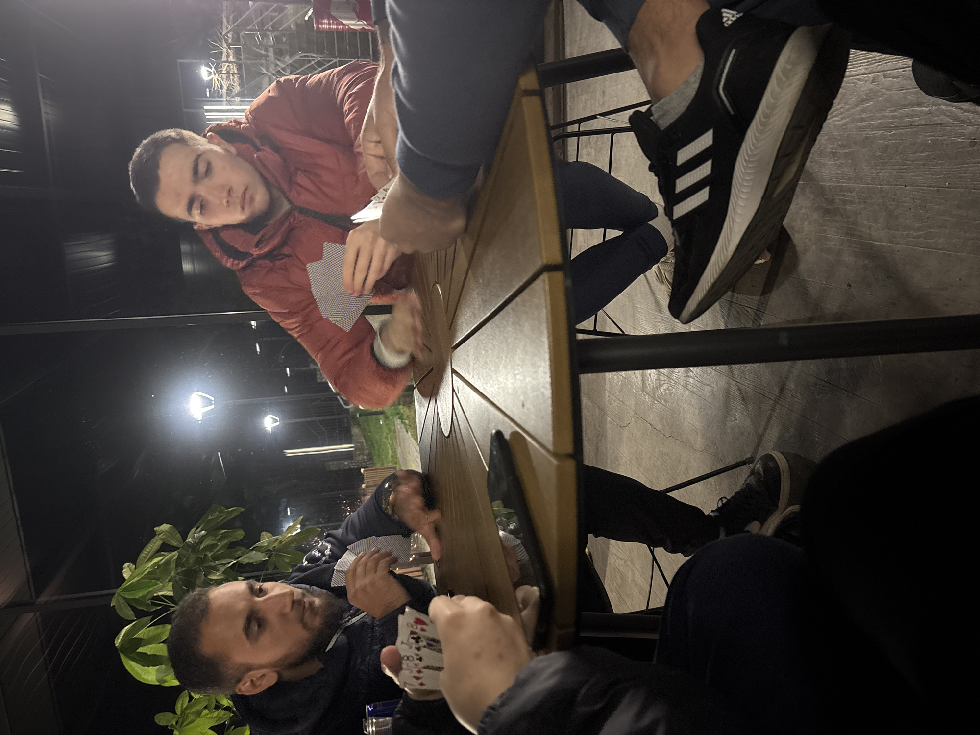 Evening card game among four people in Zlatitsa, Bulgaria