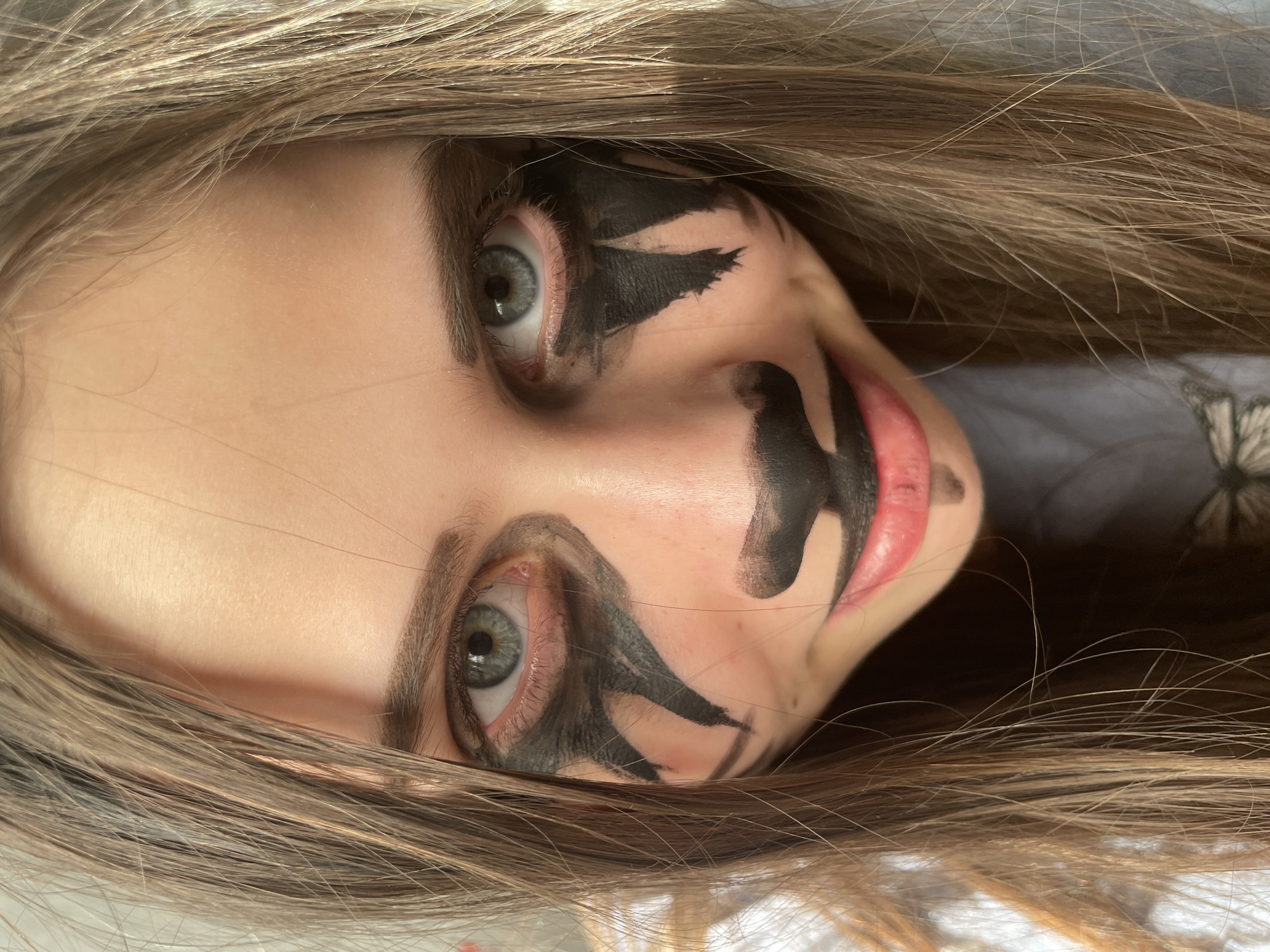 Individual photographed wearing theatrical face paint in Izhevsk
