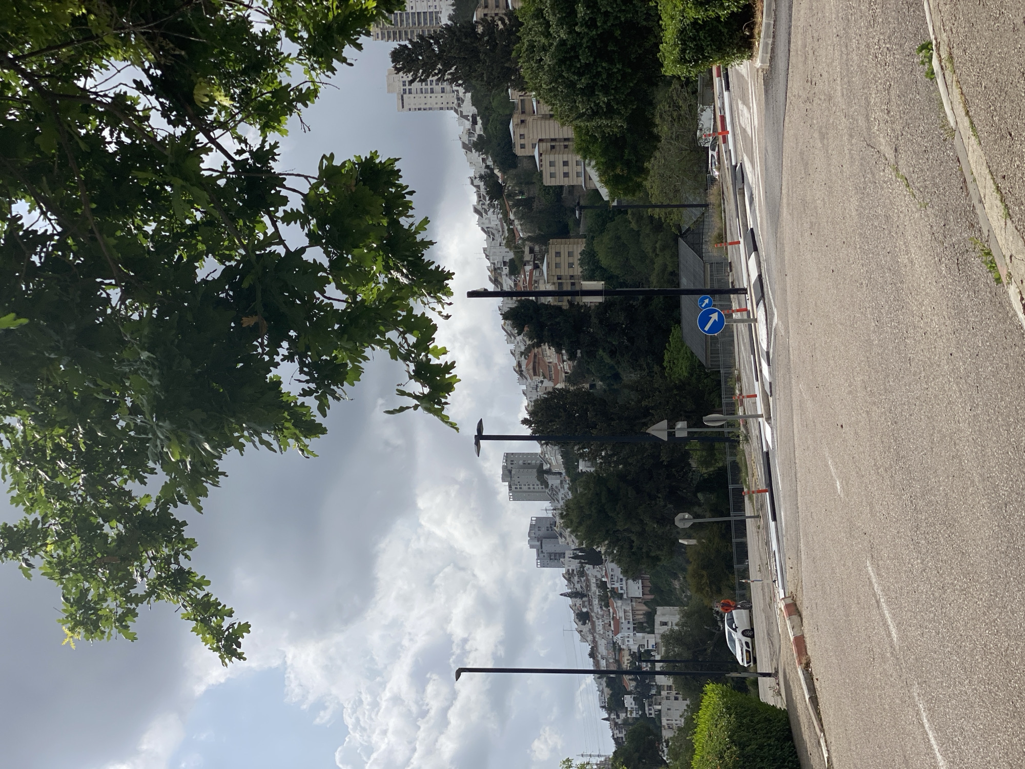 Morning street scene captured on downhill road in Haifa