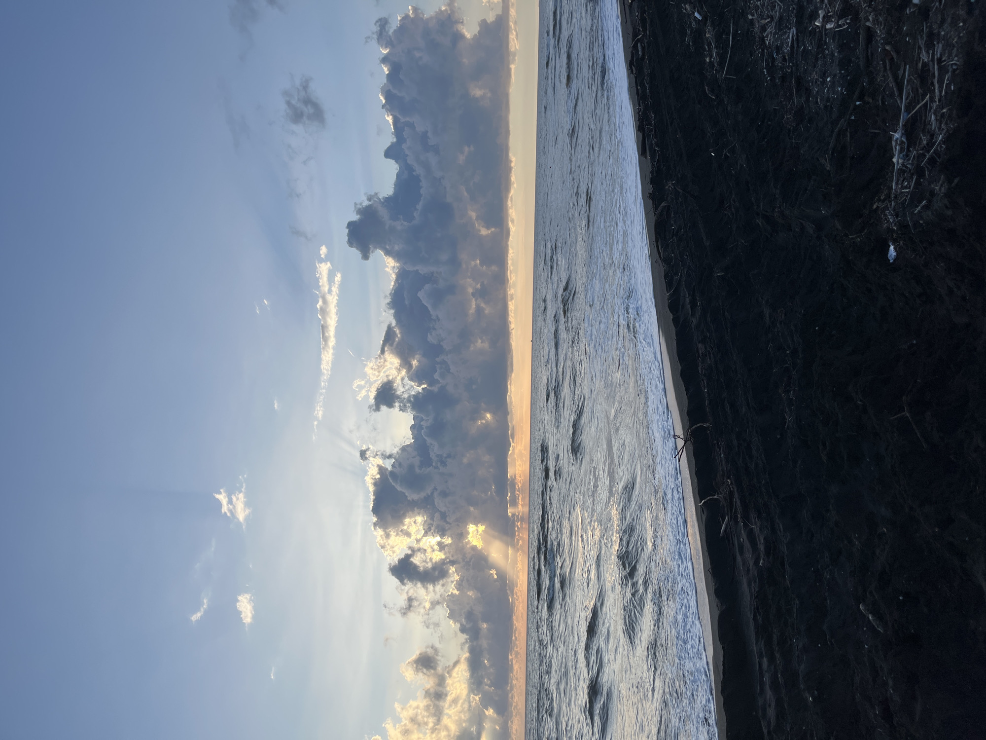 Sunset scenes along Ureki's black sand beach in Georgia