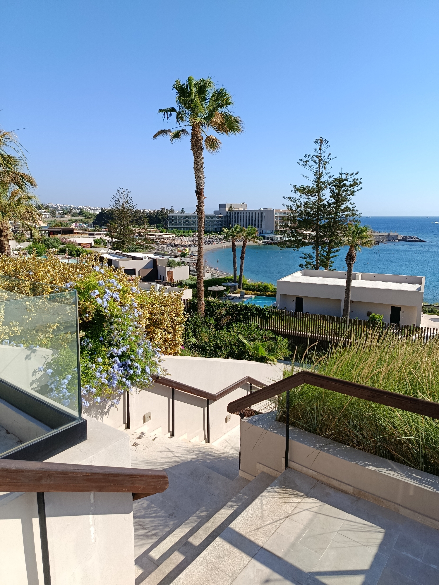 Sunny morning at a Rhodes resort, pool and bay views