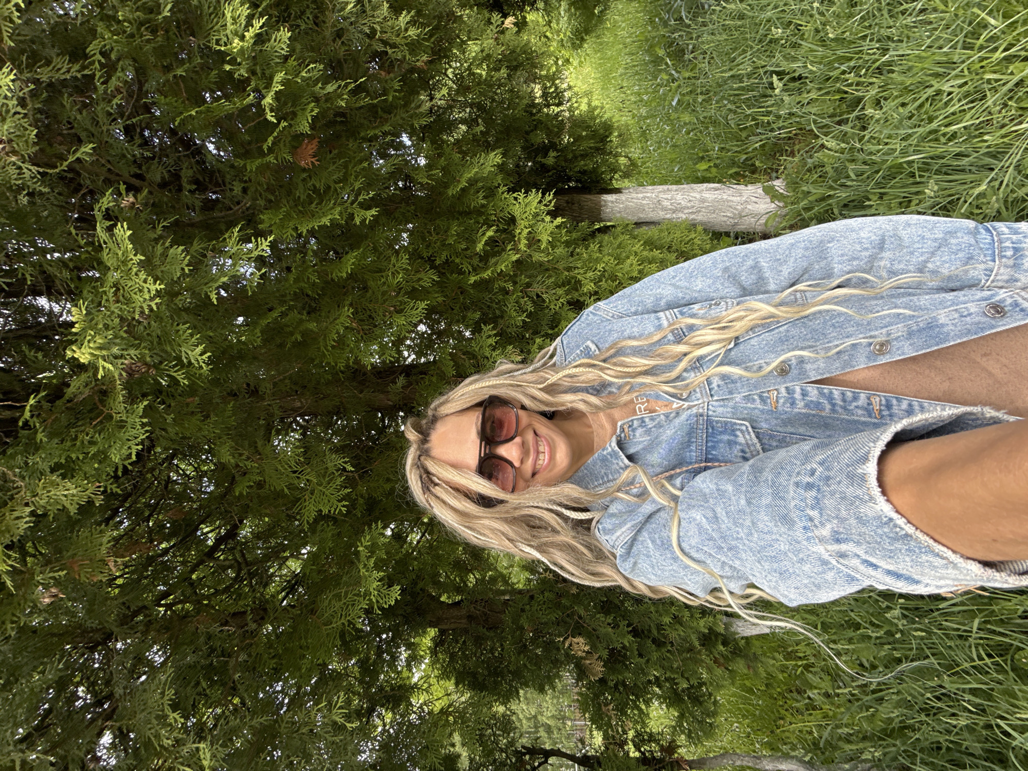 Woman poses for spring photo session among flowers in Rusanovo