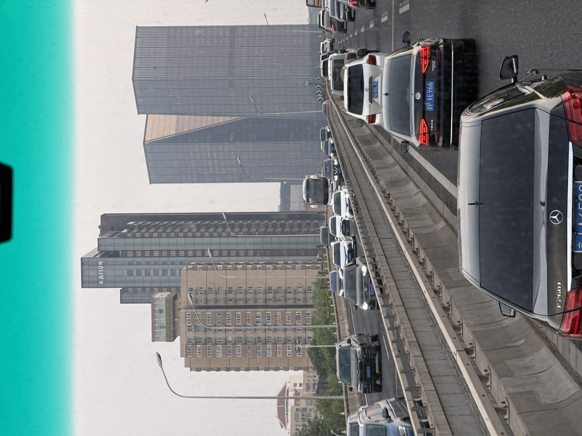 Beijing traffic crawls under orange morning sky across districts