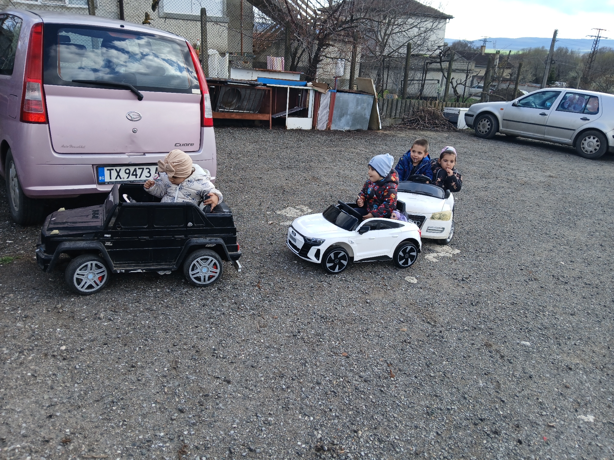 Children play with toy cars in Bulgarian village