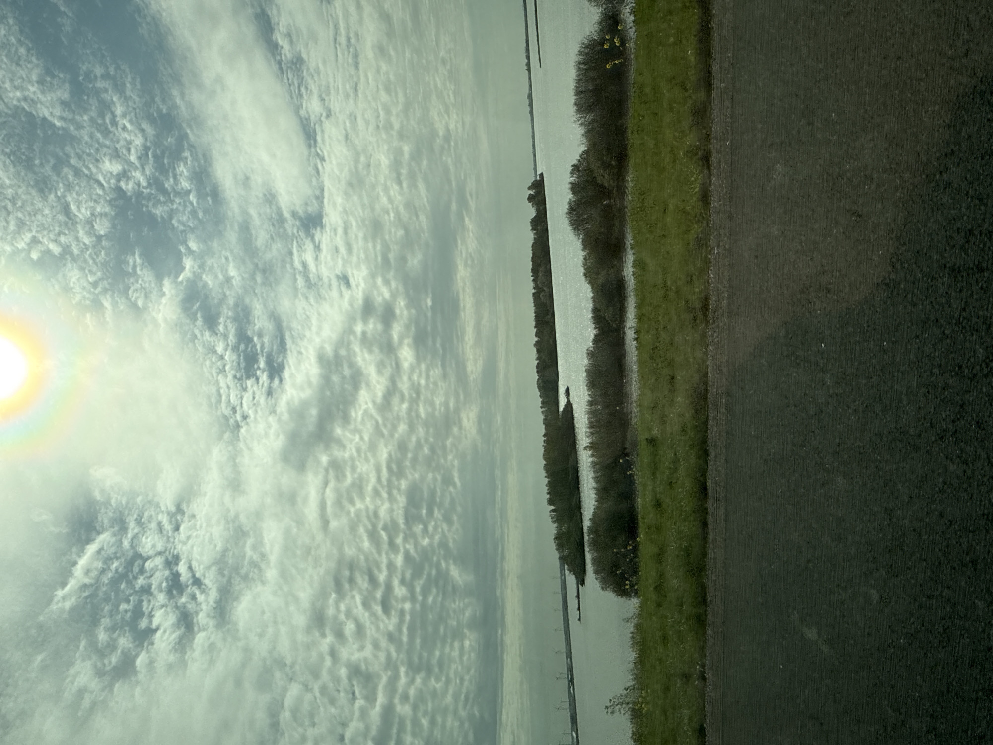 Morning travel and scenic landscapes documented near waterway