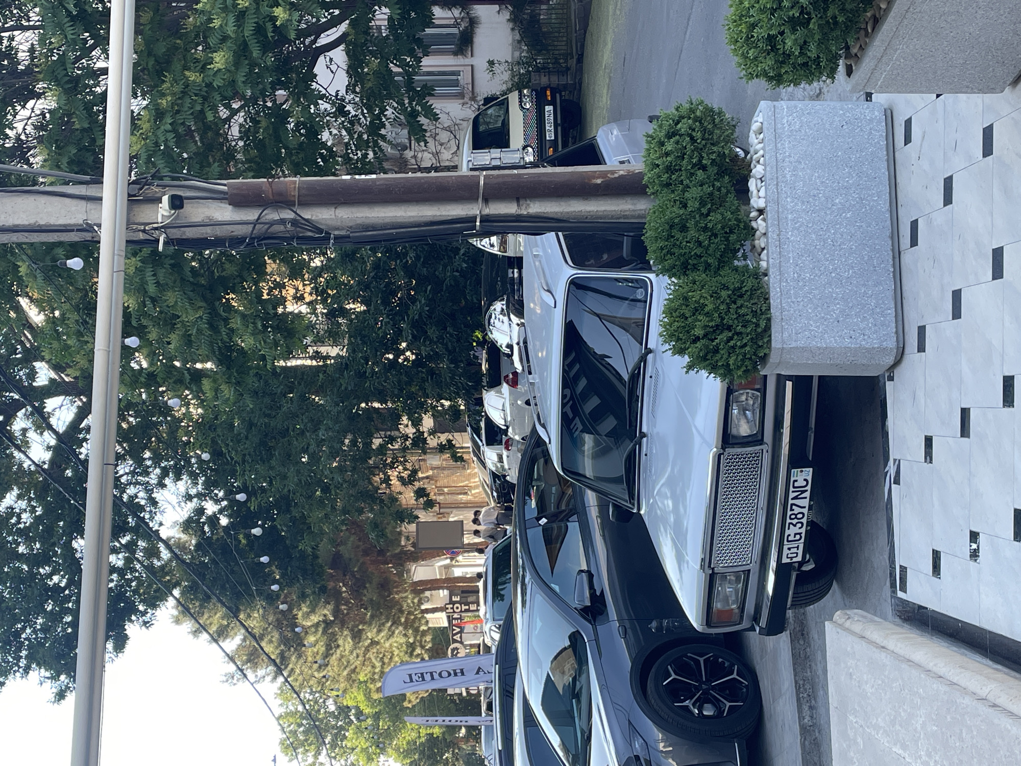 Street scenes captured in Tashkent show parked cars, pedestrian