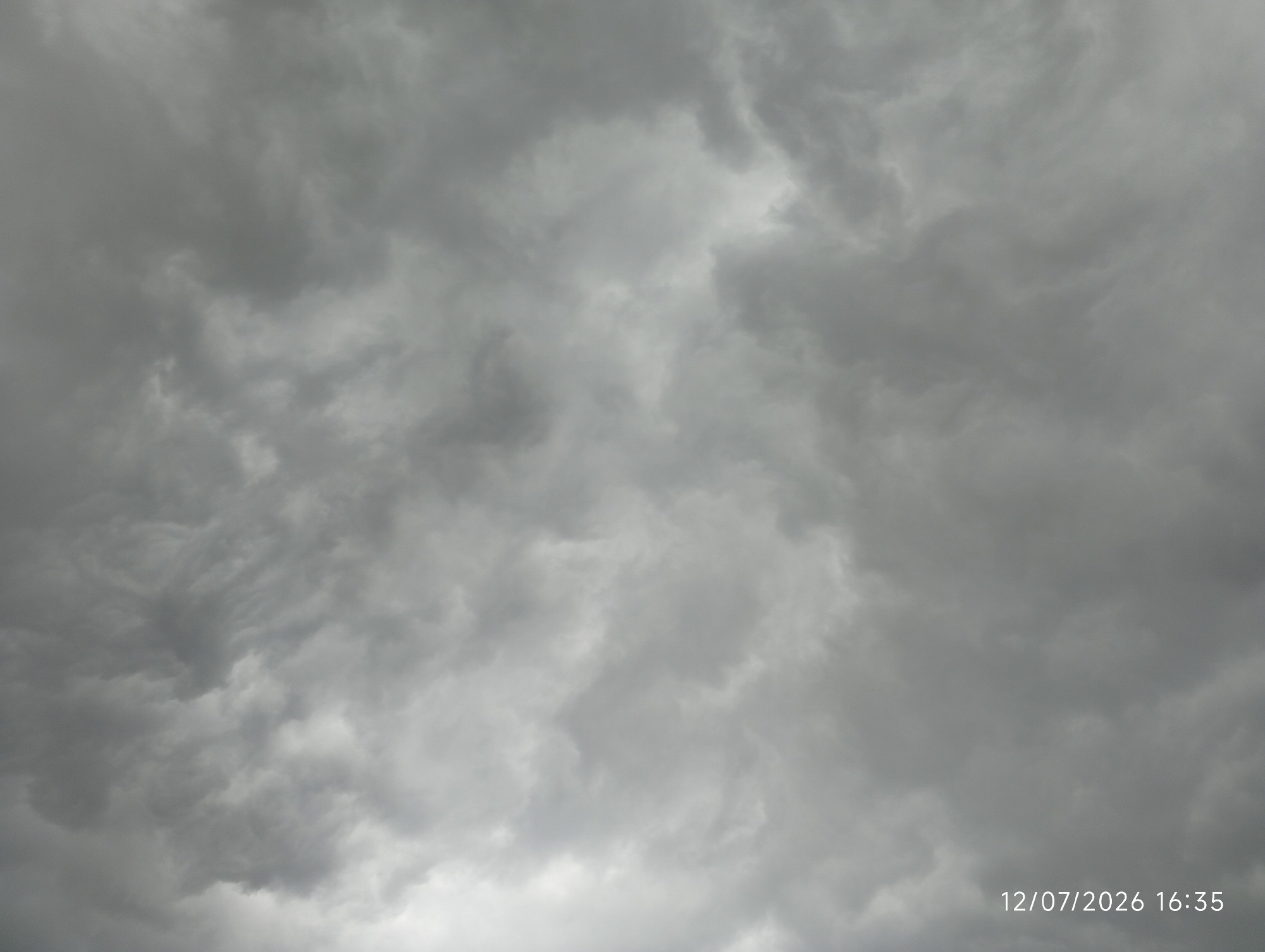 Storm clouds gather over Bana Stream, Nigeria