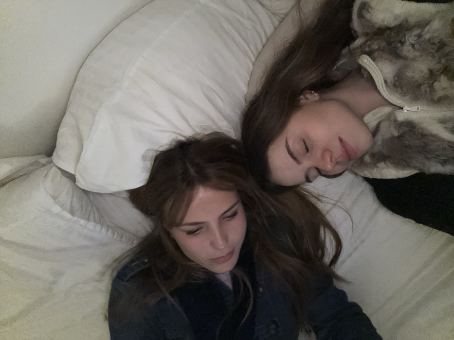 Two women rest in Parisian apartment near café de la poste