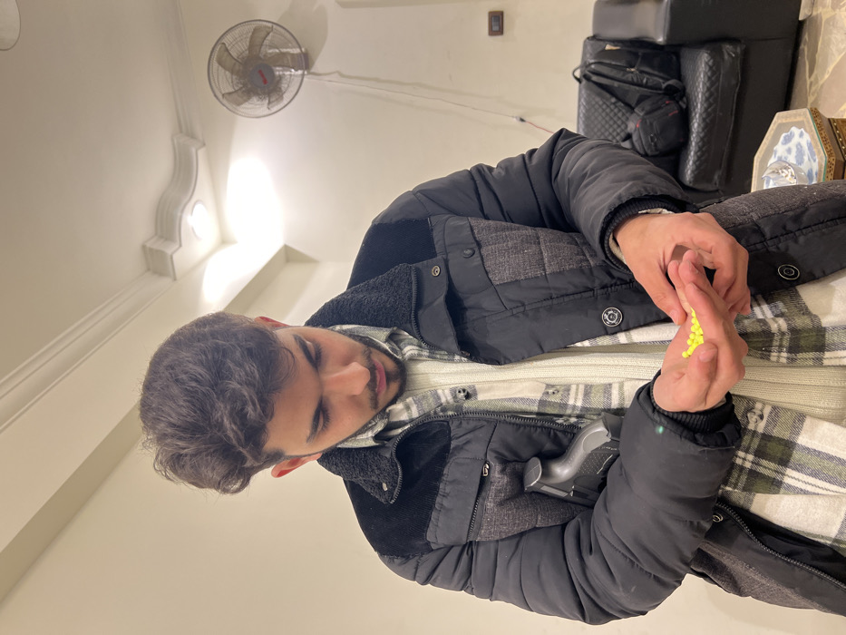 Man plays with toy guns in Damascus office