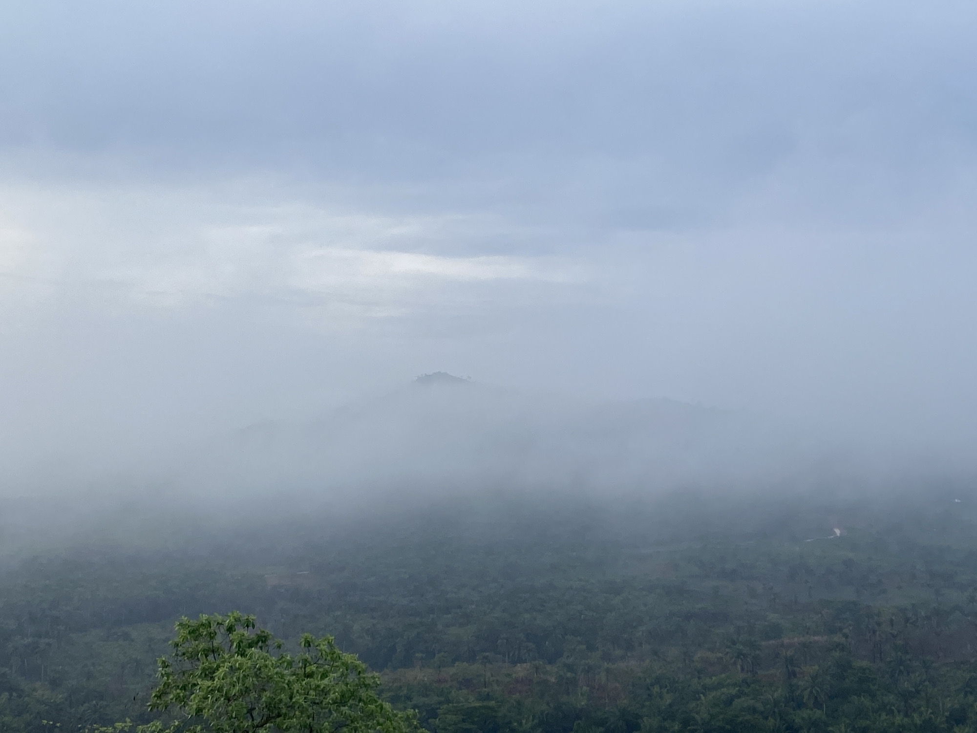 Morning fog blankets mountains in Achara, Nigeria