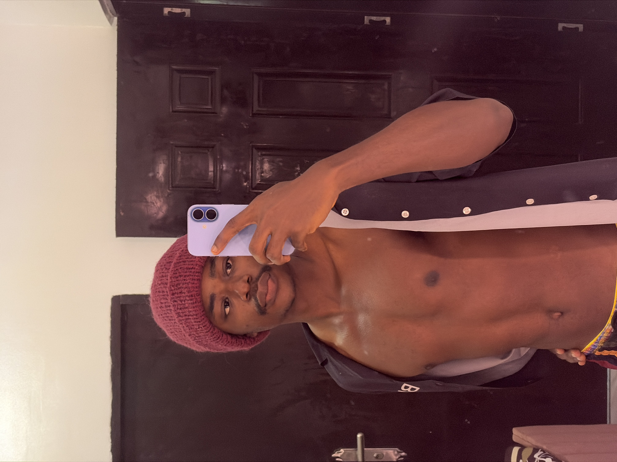 Man takes selfie with purple phone in Igboefon residence