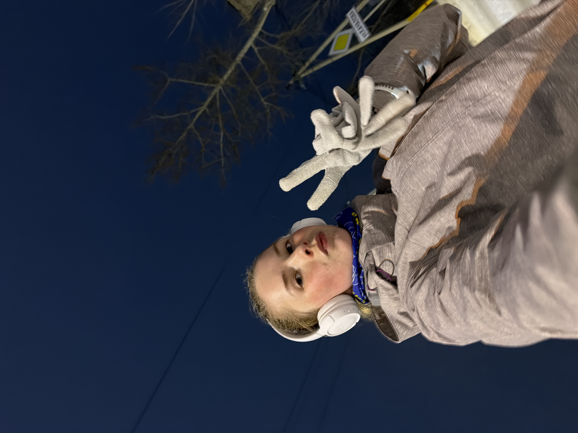 Woman takes nighttime selfies in snowy Berezniki streets