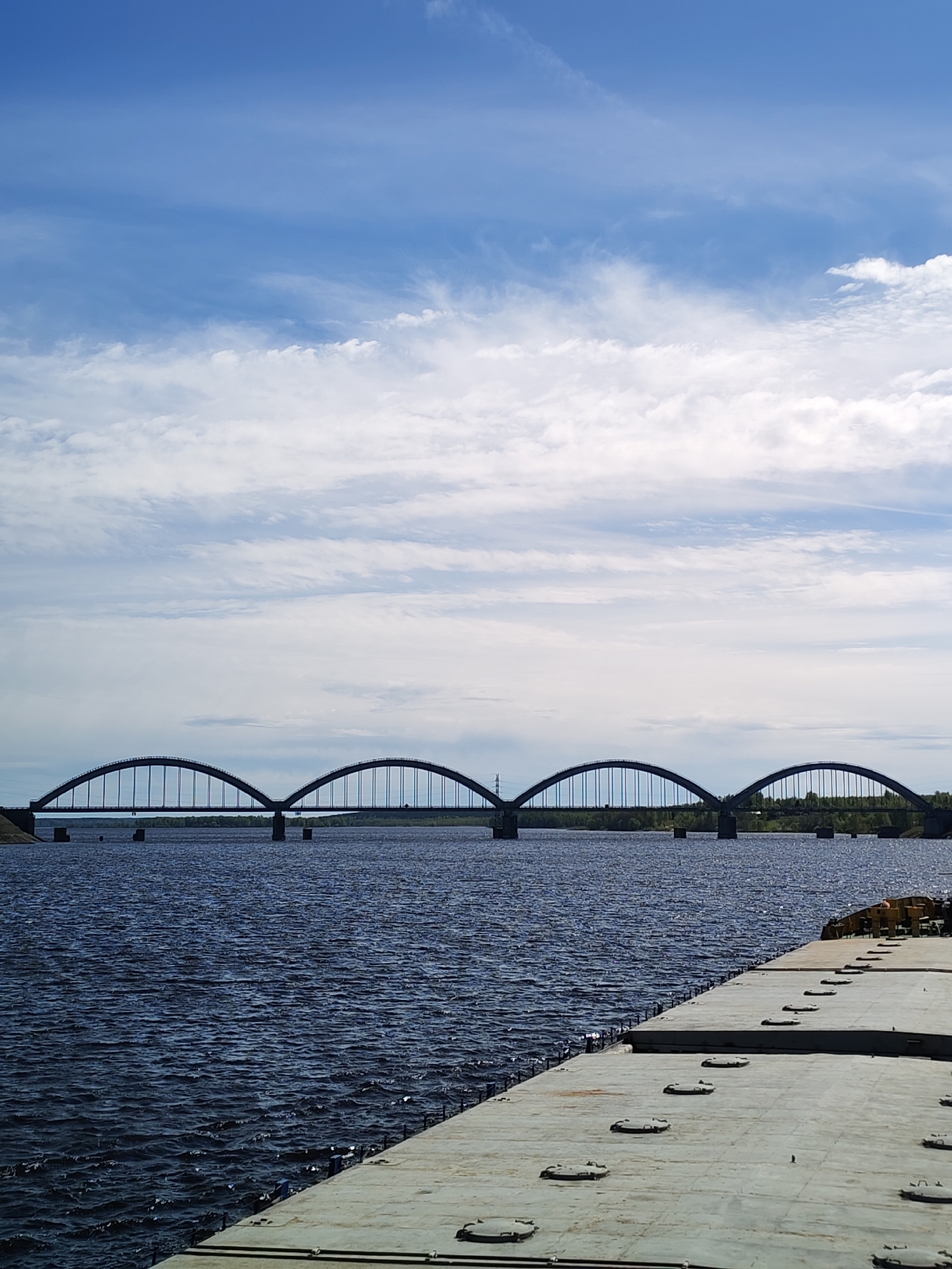 Multi-arch bridge spans water in Krasnyi Rybak, Russia