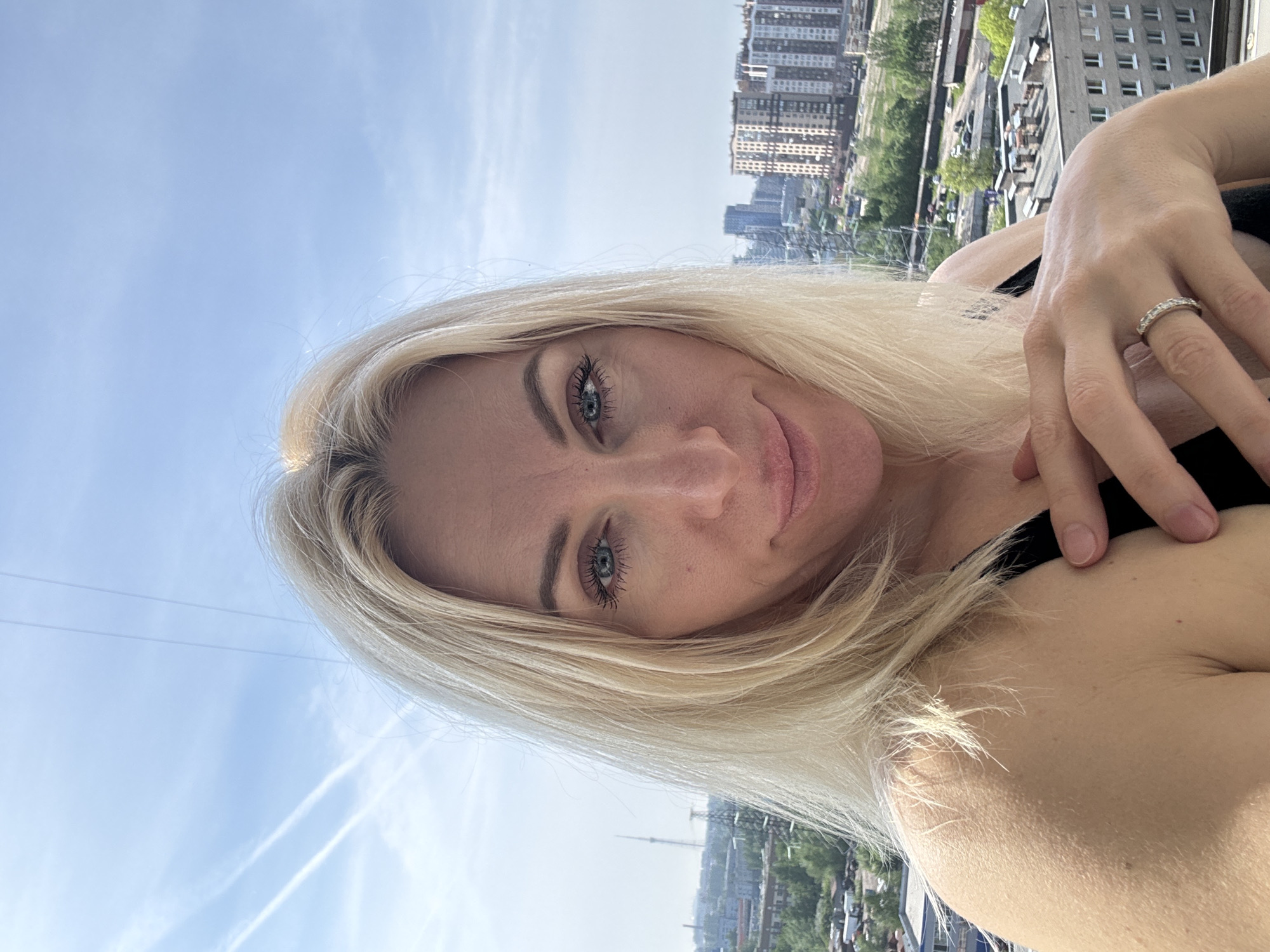 Urban routine: selfies and lawn care captured simultaneously